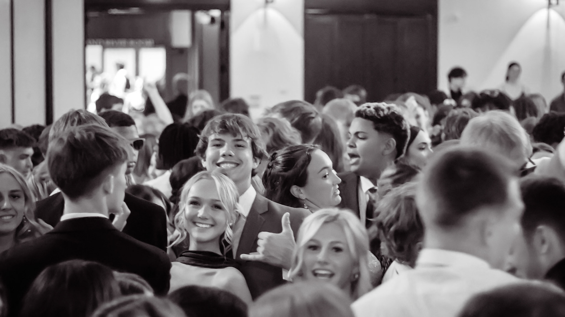 Caught in the crowd but still standing out, Ada Decker and her date making the most of every prom moment together. (Photo by Natalia Teneyuque)