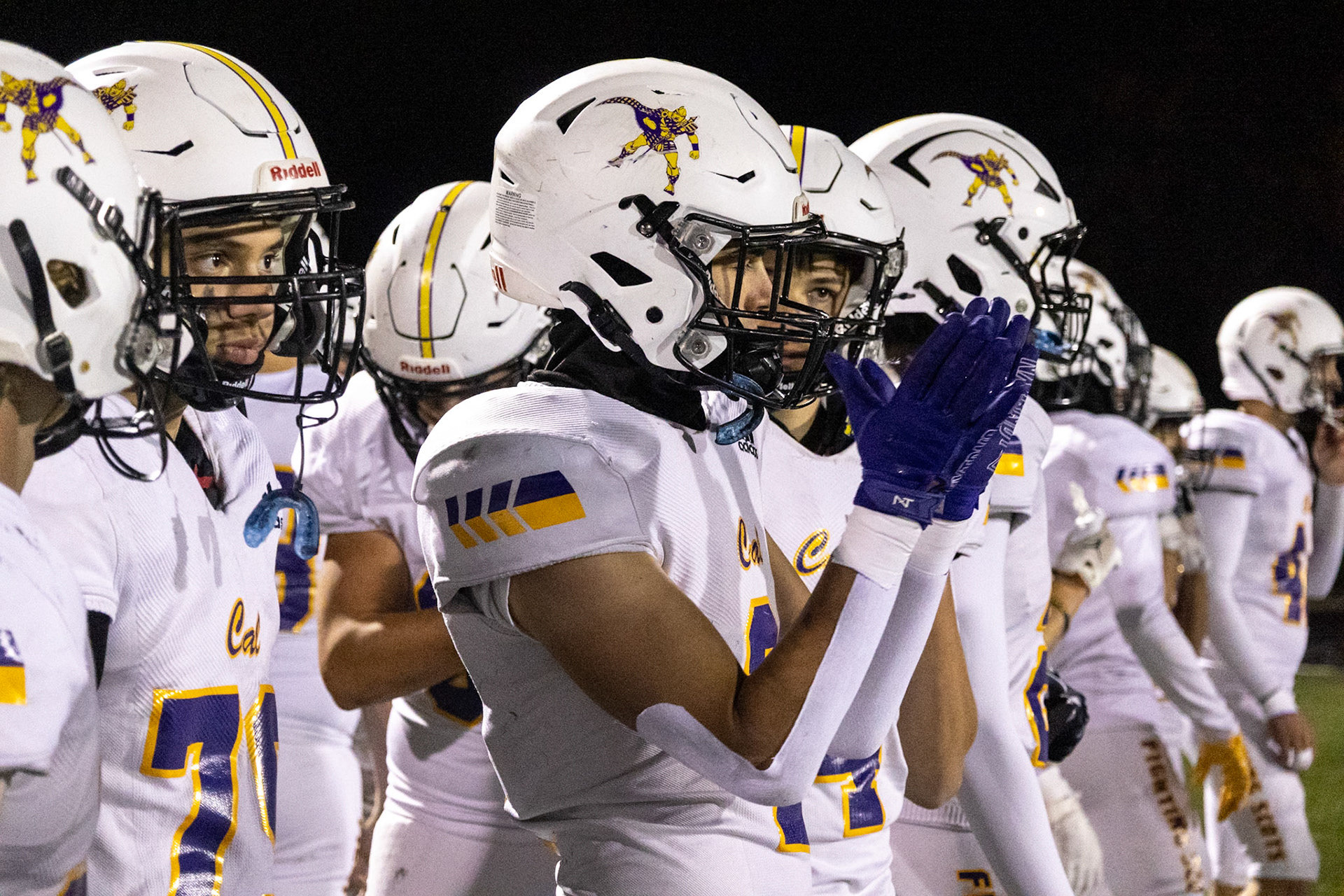 After Caledonia’s offense earns a first down, Jimmy Holmes congratulates teammates who are getting their opportunity to play. (Photo by Ella-Grace Wickens)