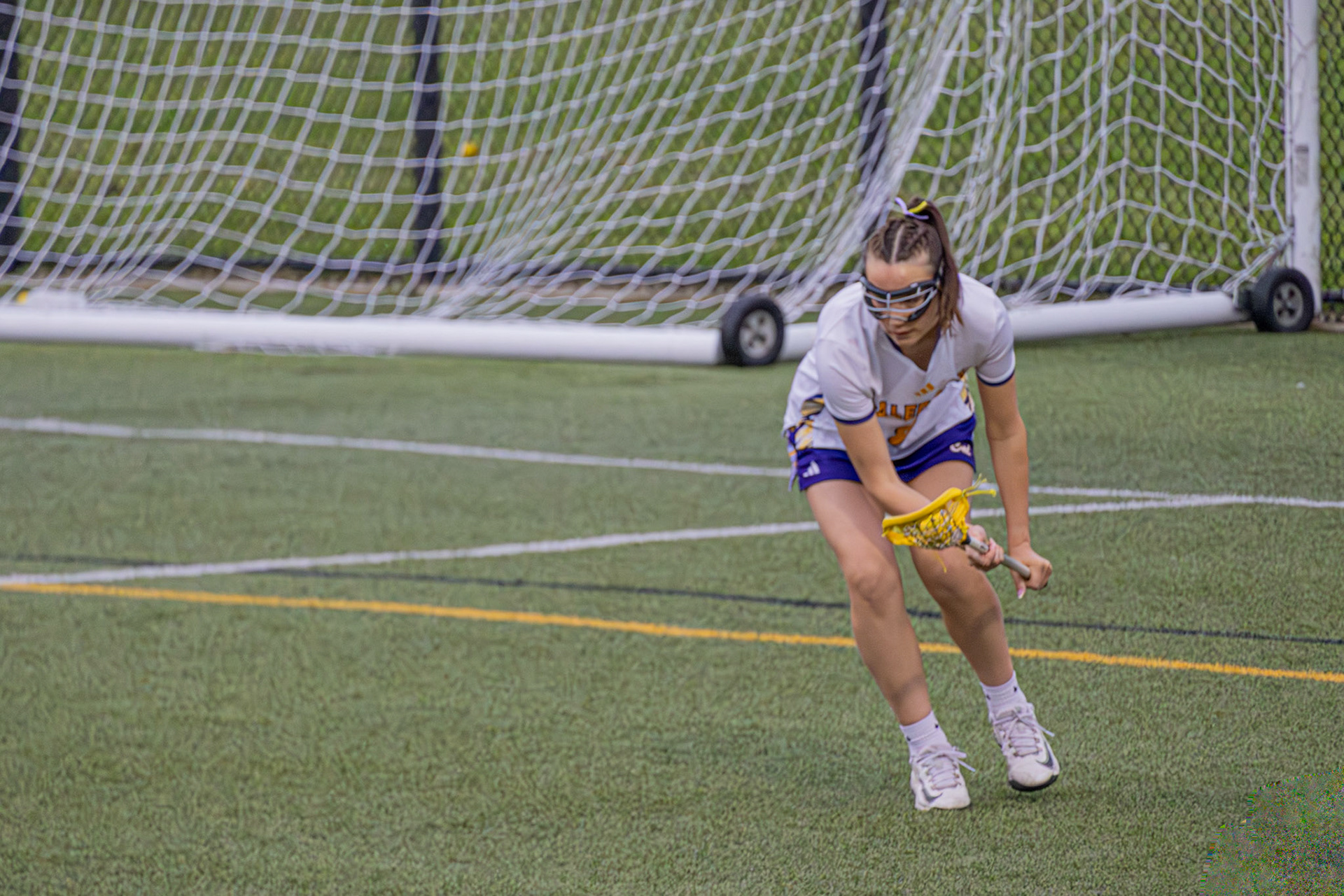 After knocking the ball free, Morgan Barthel steals it and turns upfield toward the offensive end. (Photo by Abby Skibinski)