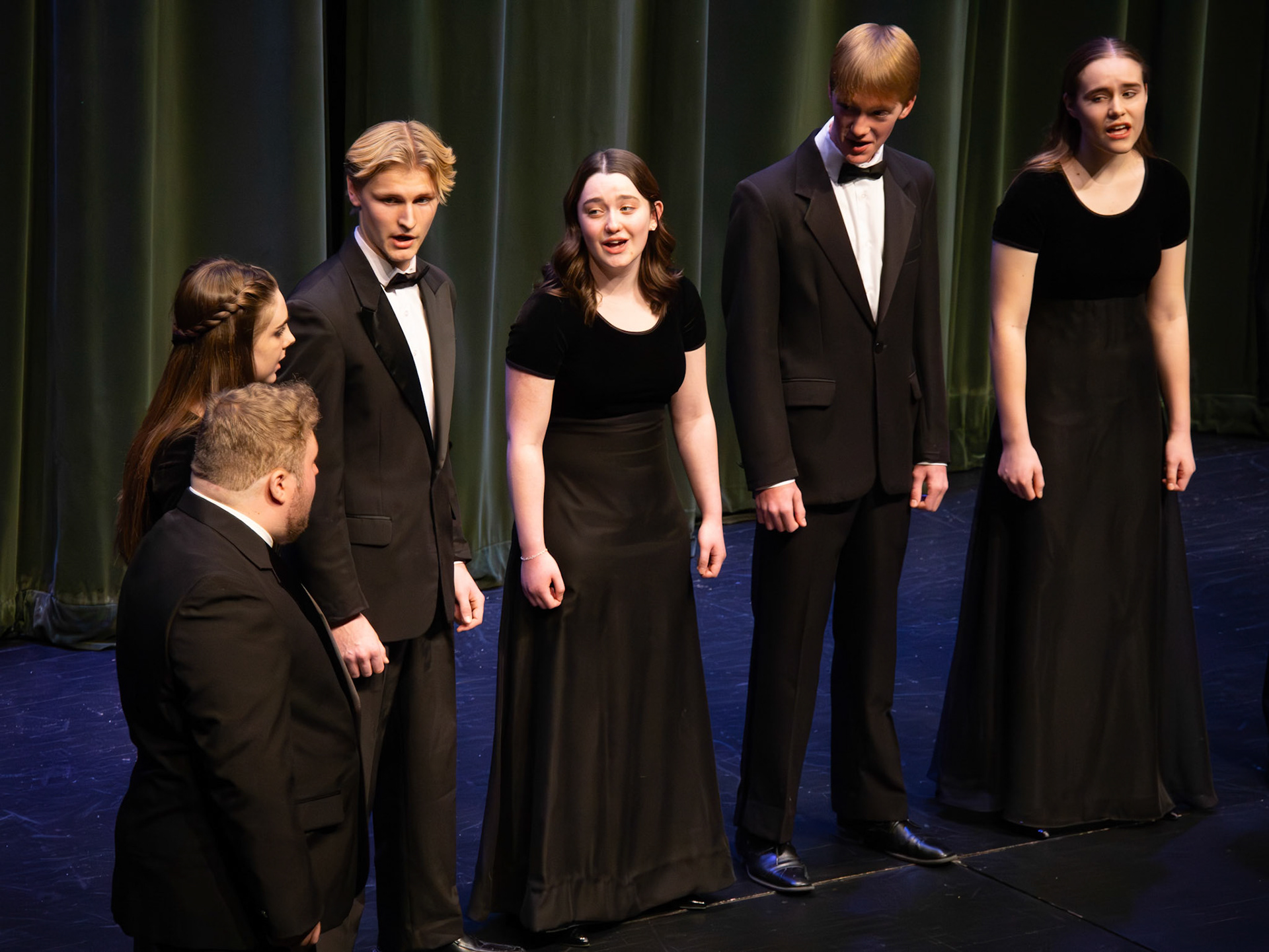Alister Brew, Allison Malone, Connor Parlin, Lydia Shoesmith, Christian Moorlag, and Addison Cook take the stage as a powerhouse group, owning the spotlight at the Treble/Bass Concert. (Photo by Addi Thornton)