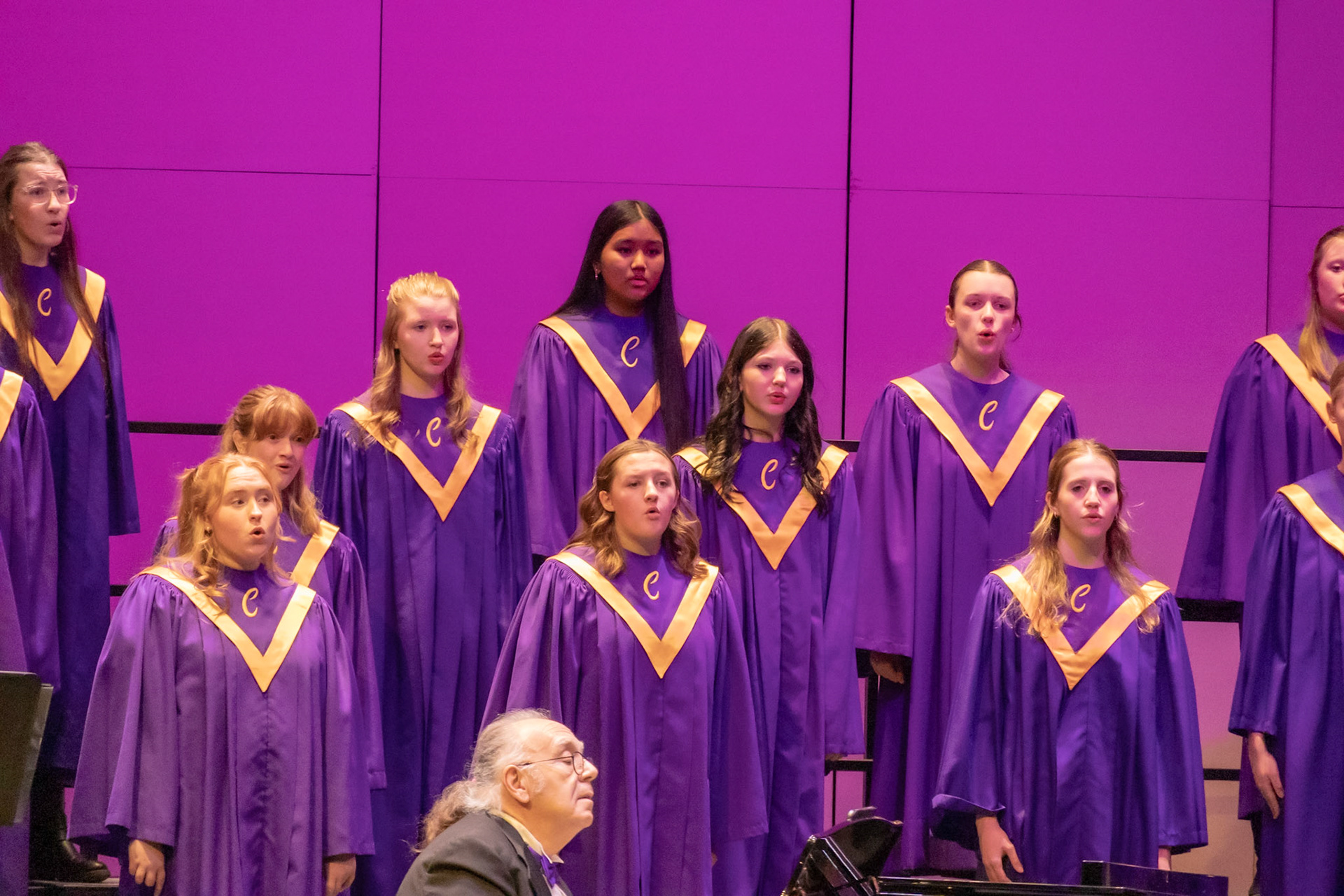 Freshmen Emily Hilton, Briella Palermo, Bawi Hnem and Junior Maddie Layton sing intensly during the 2026 Winter Treble-Choir Concert.  (Photo by Lucas Swartz)