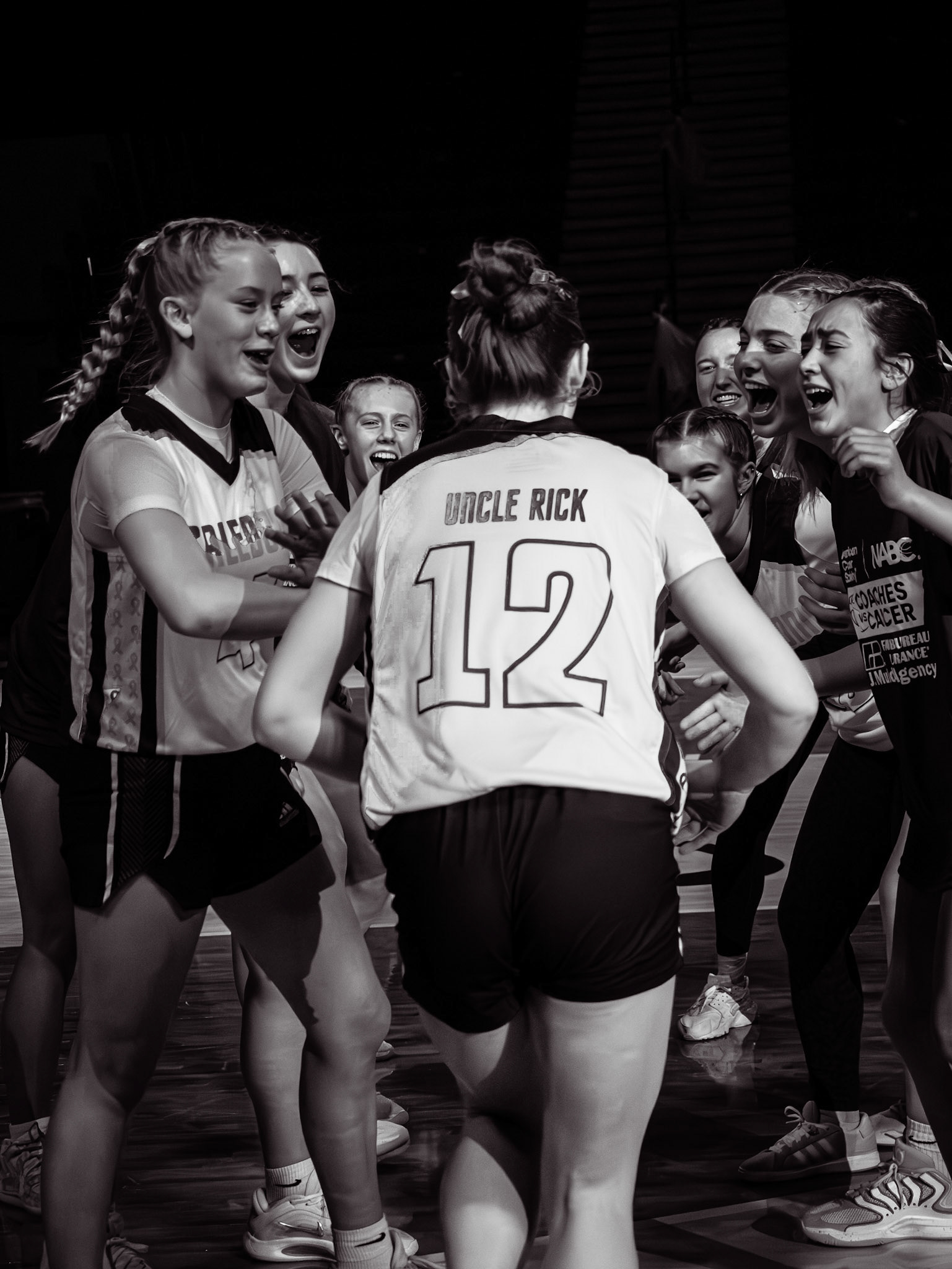 Running down the court, Jolie soaks in every cheer and high five on cancer night, honoring her Uncle Rick as his name and her number light up the gym. (Photo by Aibree Akers)