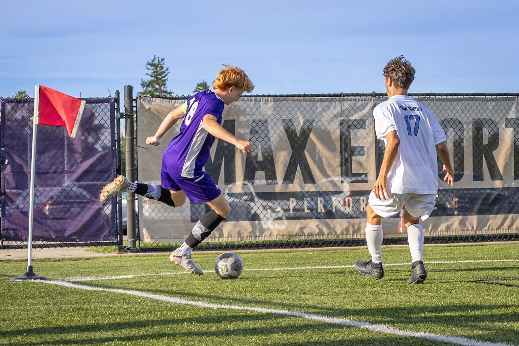 Trapped in the corner, Brecken Byrd sends a cross into the middle, setting up a scoring chance for his teammates. (Photo by Rhyan Guzman)