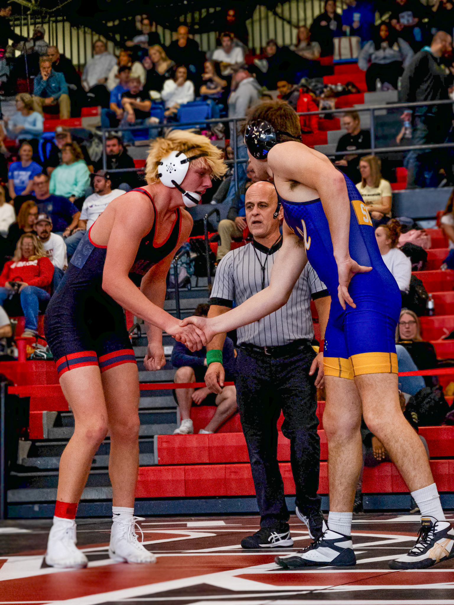 After a match against East Kentwood Koleson Reeder demonstrates sportsmanship. (Photo by Jeremiah Pitman)