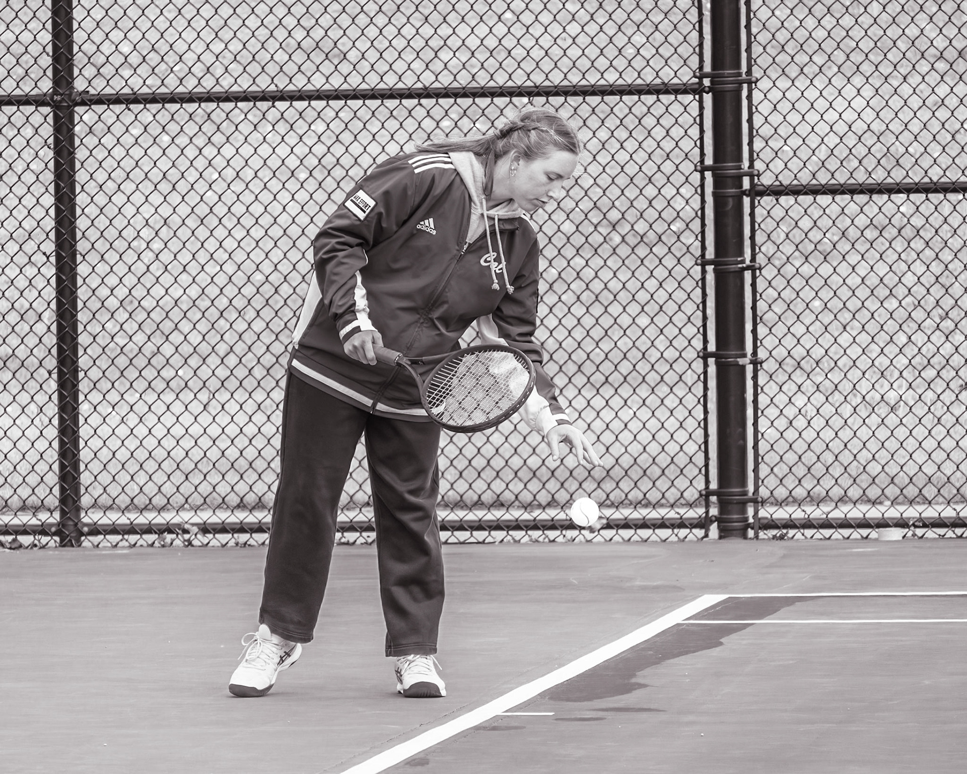 Molly Liggett sets up with focus and confidence before each serve. (Photo by Mya VanderZwaag)