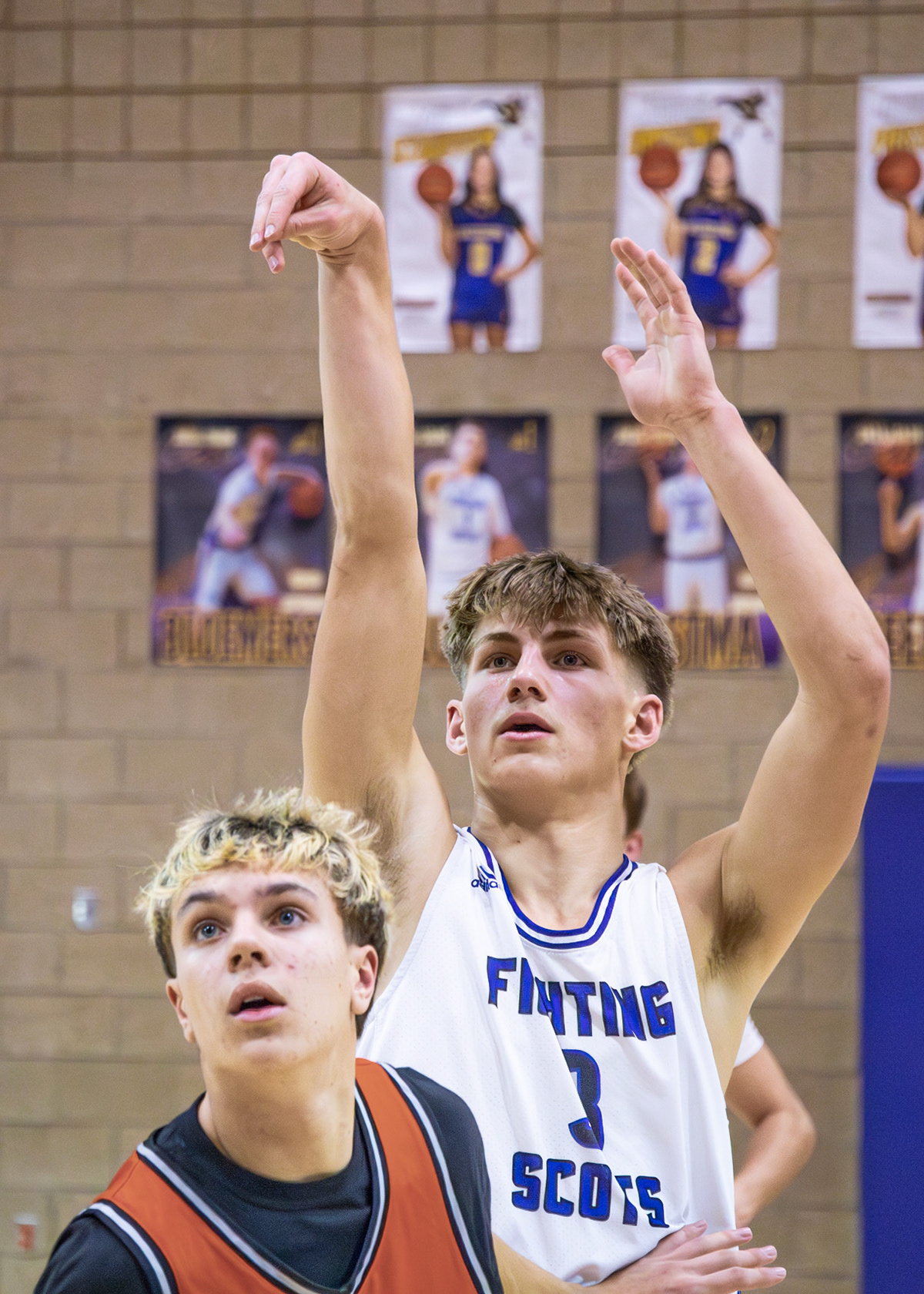 Ben Geerdes watches steadily as his shot heads toward the basket, waiting to see if it falls. (Photo by Emma Garza)