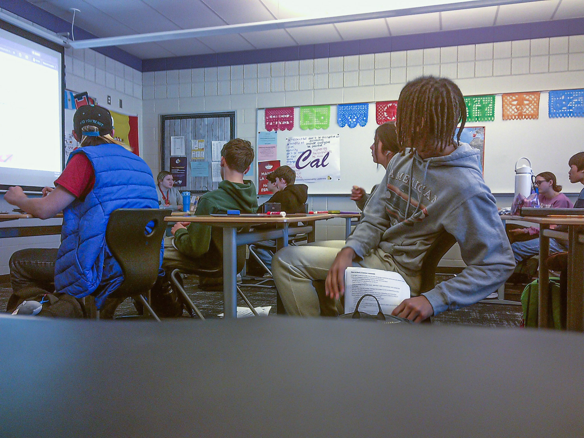 Shawn Restau finds a way to stay engaged during Spanish class. (Photo by Lilly Myers)