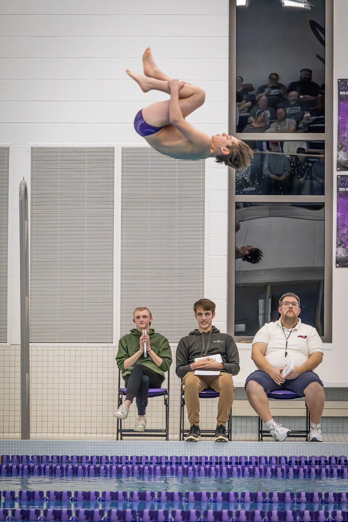 Abram Sturman demonstrates technique with a flip off the board, highlighting his strength and focus. (Photo by Hailey Thayer)