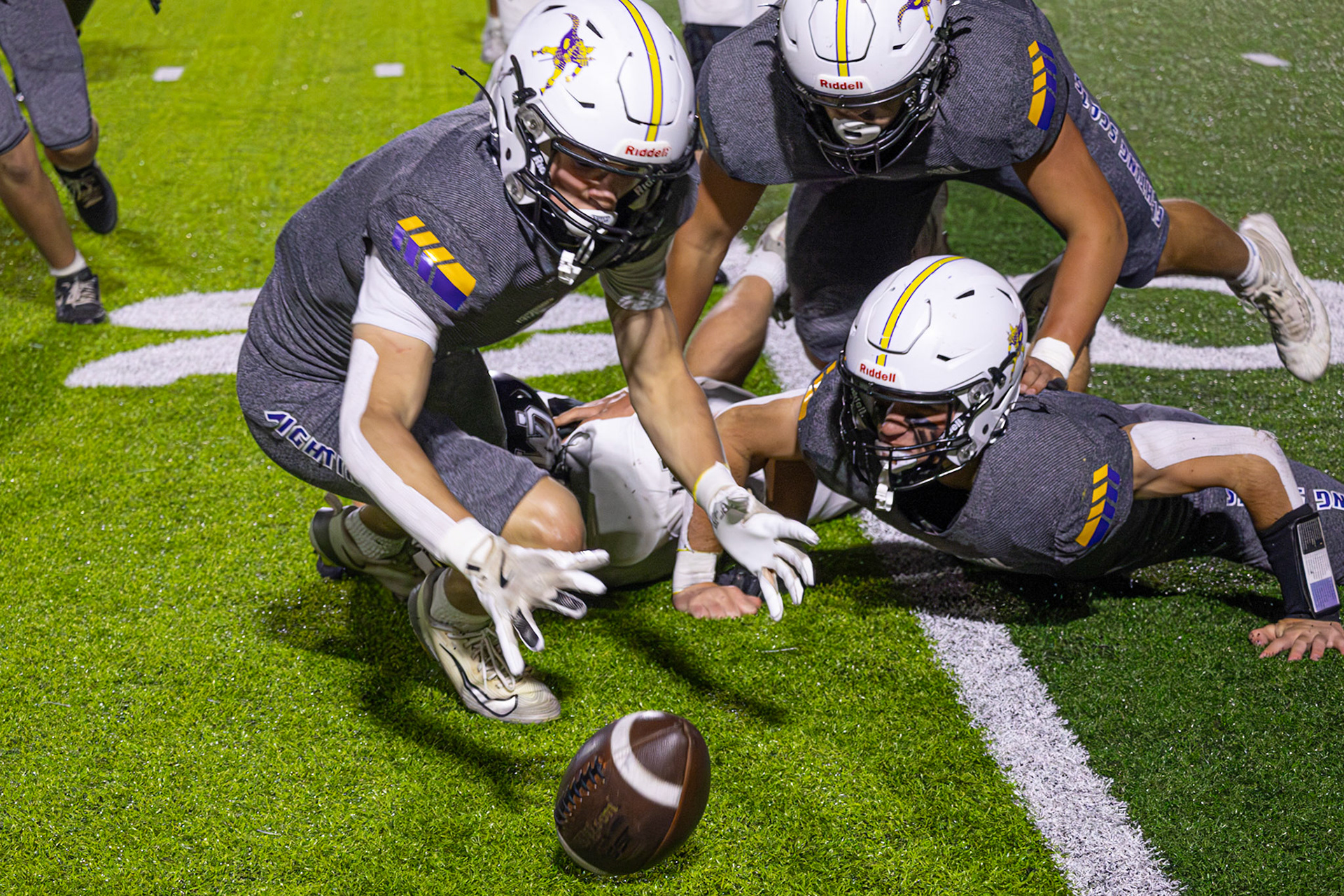 Logan Pratt spots a fumble by a West Ottowa Panther and dives to the ball. Every turnover has a story, this one had Pratts name on it. (Photo by Khloe Lowande)