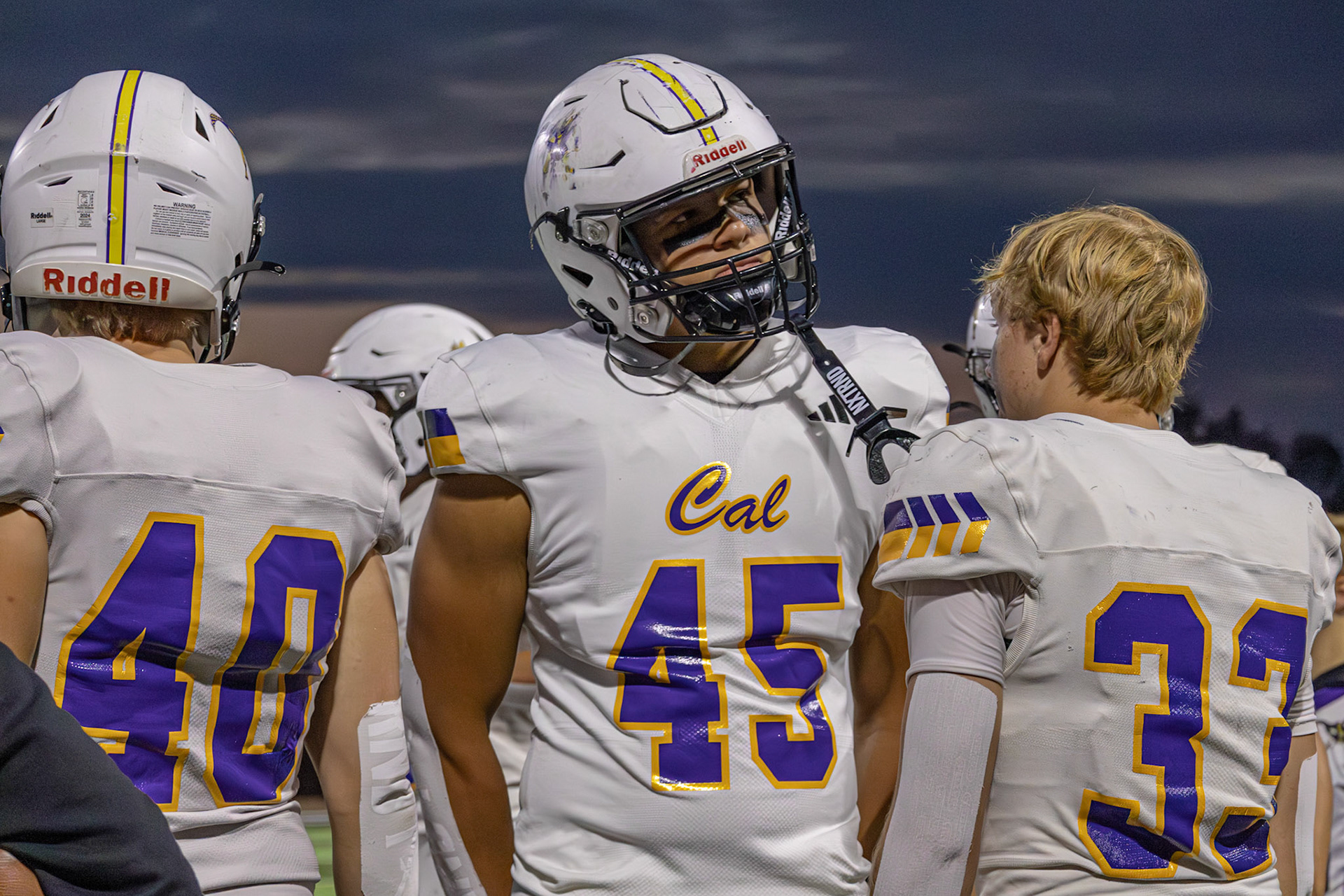 From the sidelines, sophomore Xavier Stewart keeps his gaze on the game, ready for his next play. (Photo by Avarey Lippert)