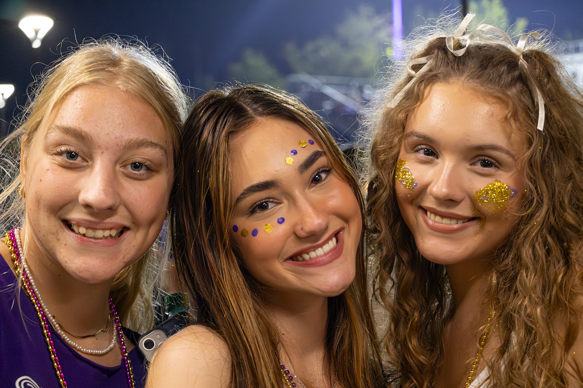 Pausing for a quick photo, Elizabeth Gray, Leila DeOliveira-Terzic, and Keira Marshall take a moment to enjoy the excitement of Homecoming. (Photo by Brianna Severson)