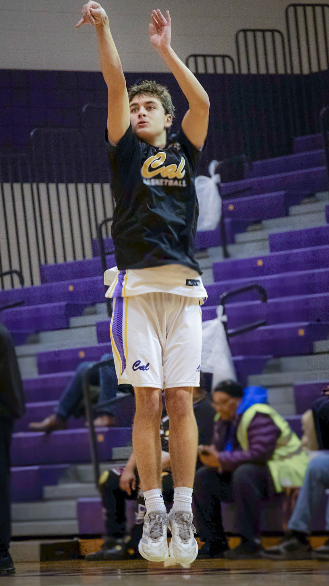 Connor Bloomers warms up by shooting around before the game, getting ready to take over and find his rhythm. (Photo by Lilly Myers)