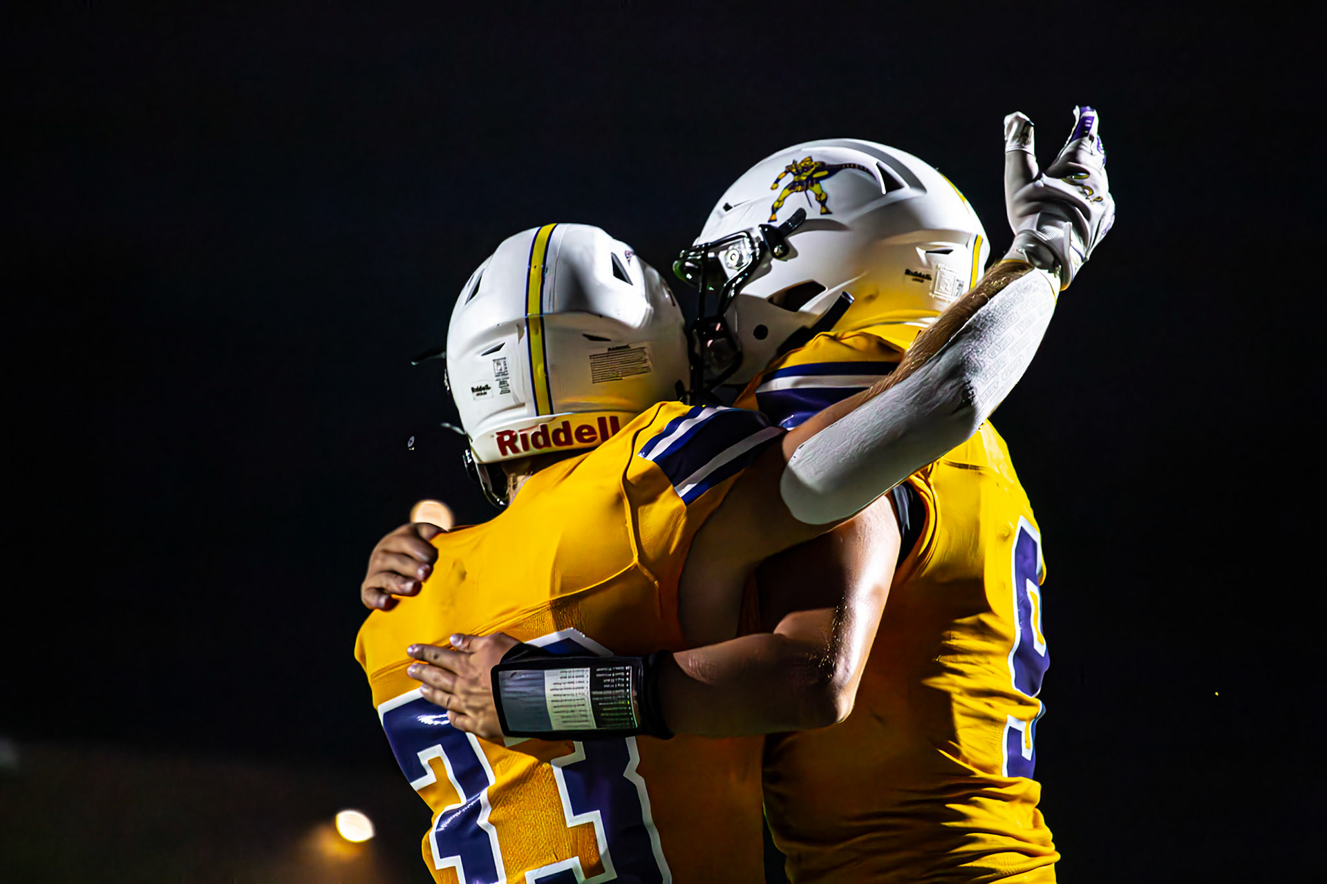 THRILL OF THE SCORE Conlan Schultz and Ryne Wysocki celebrate a huge play for Caledonia under the lights. (Photo by Egan Otto)
