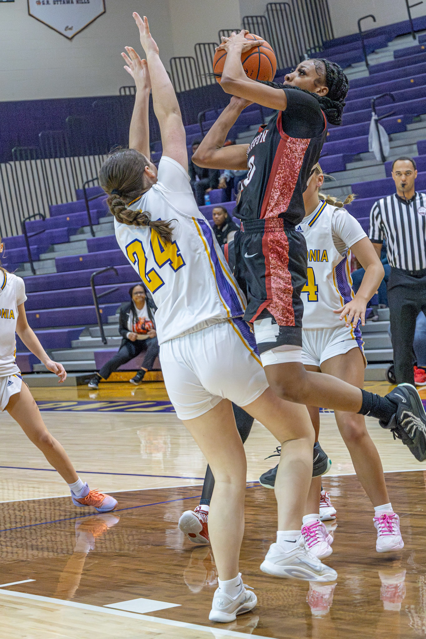 SHOT DENIED Isabella Palmitier shuts down a Muskegon player’s shot in the varsity matchup. (Photo by Taya Penoes)