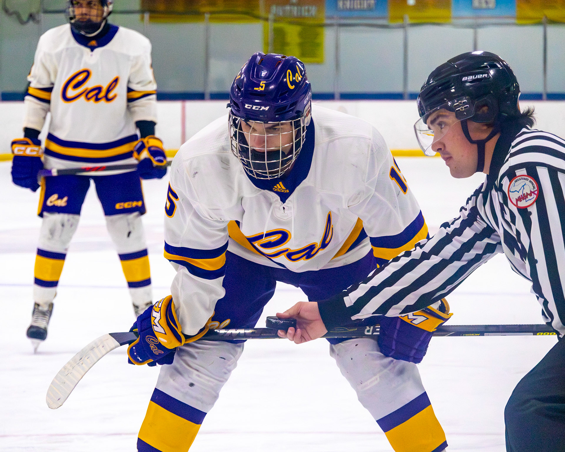 Ethan Sova moves into position for the face-off, waiting for the referee to drop the puck. (Photo by Avarey Lippert)