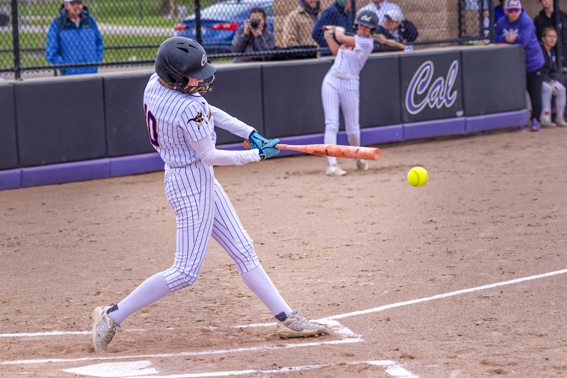 Addyson Olin connects at the plate driving the ball into play for the Scots. (Photo by Landry Mueller)