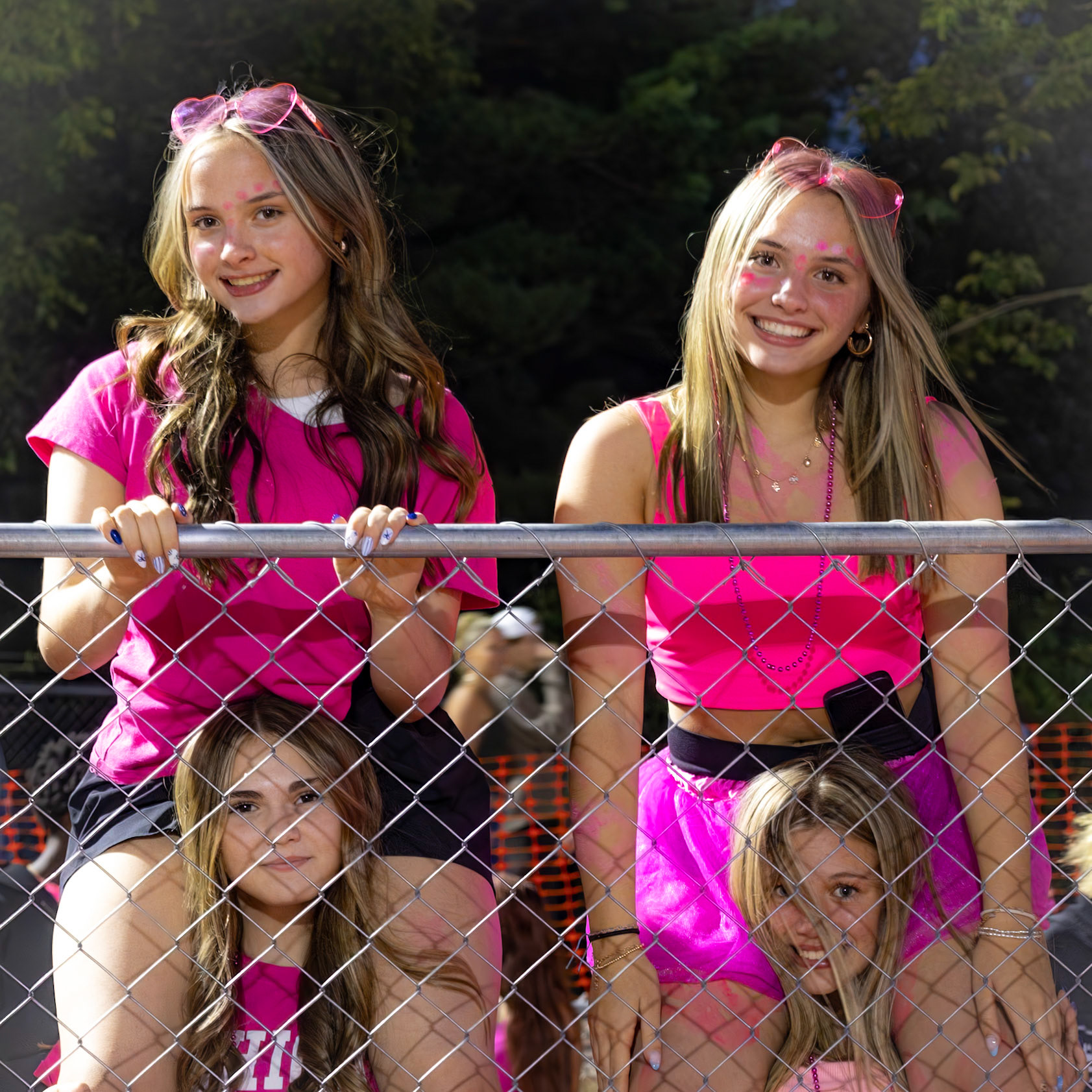 Sophomores Jaycie and Jordyn Duffy show off their Cal spirit in pink at the first game in the new stadium.