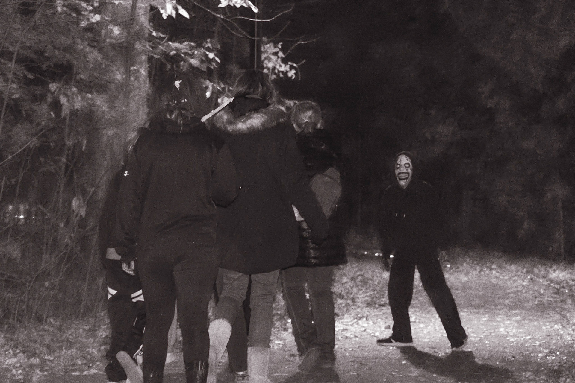 Smiles vs. screams as the girls stare down their scariest moment of the night. (Photo by Mackenzie Popma)