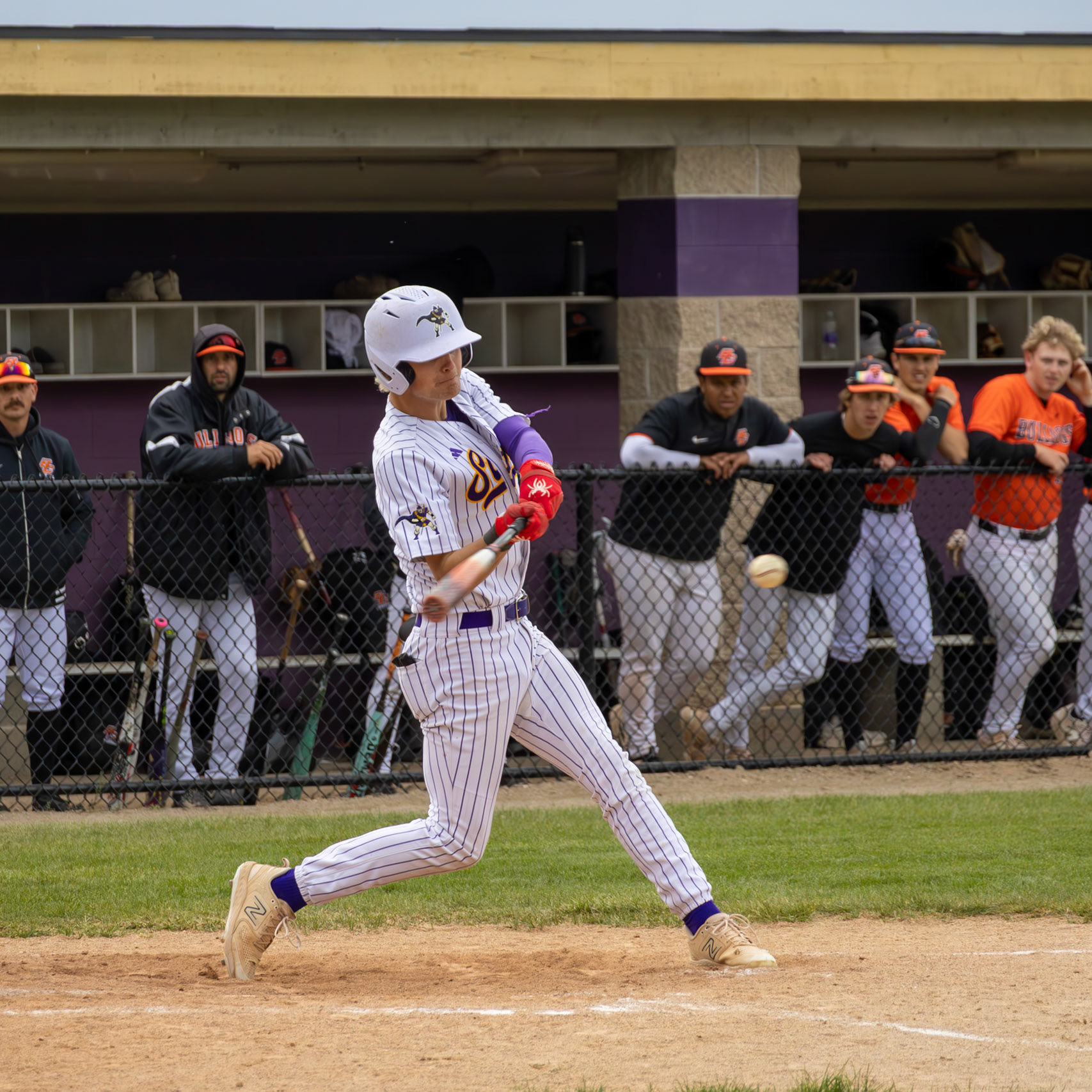 Ethan Sova swings at the ball and sends it to left field, allowing him to reach first base with ease. (Photo by Justin Harper)