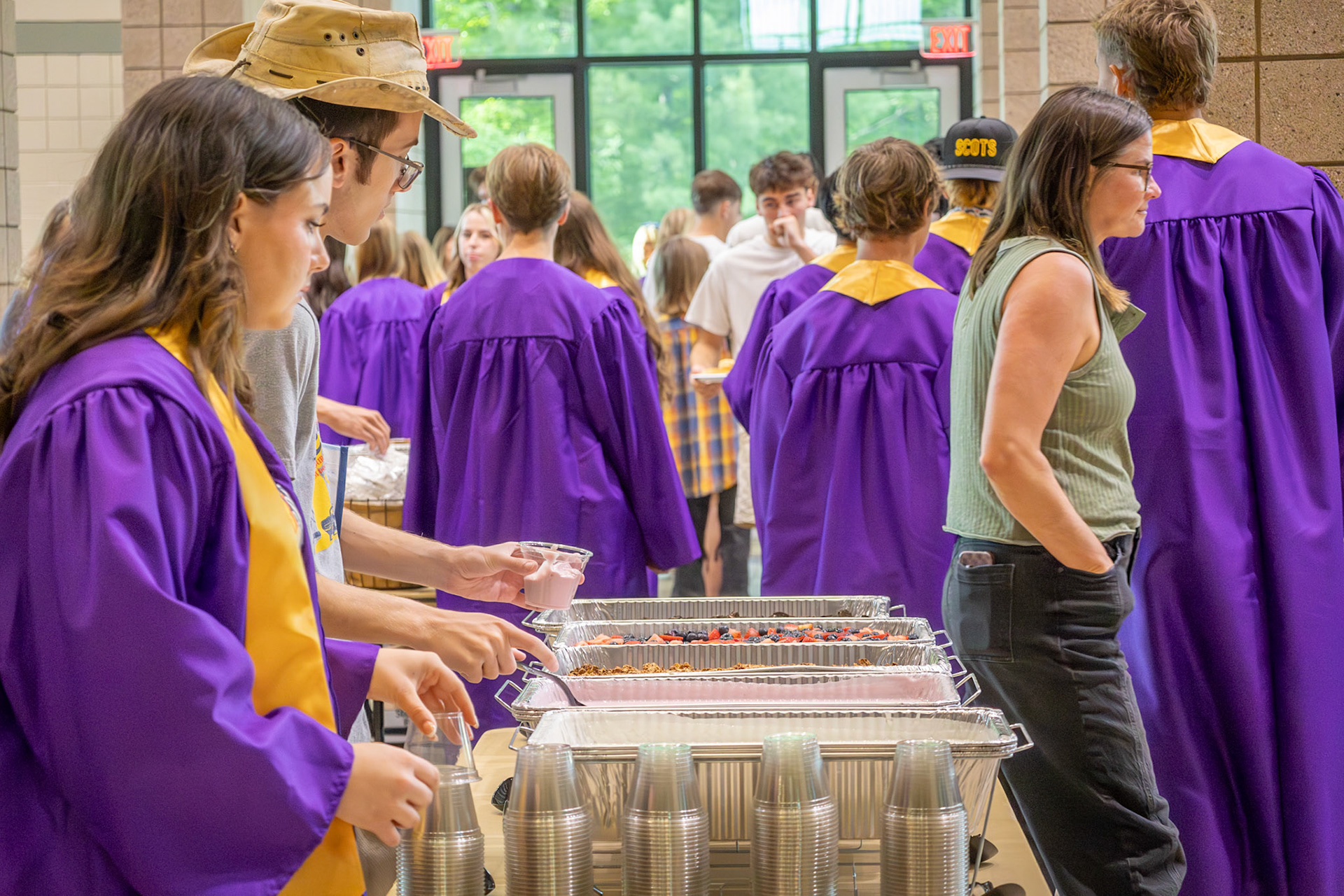 The Class of 2026 enjoys a breakfast prepared by parents during one of their final mornings at school together. (Photo by Emma Garza)