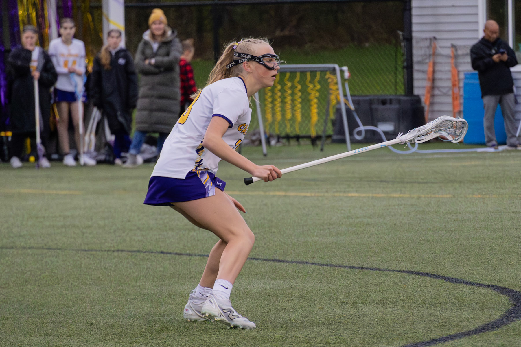 With sharp focus, Ellie Radel anticipates the other team’s plays, ready to step in and defend at any second. (Photo by Abby Skibinski)