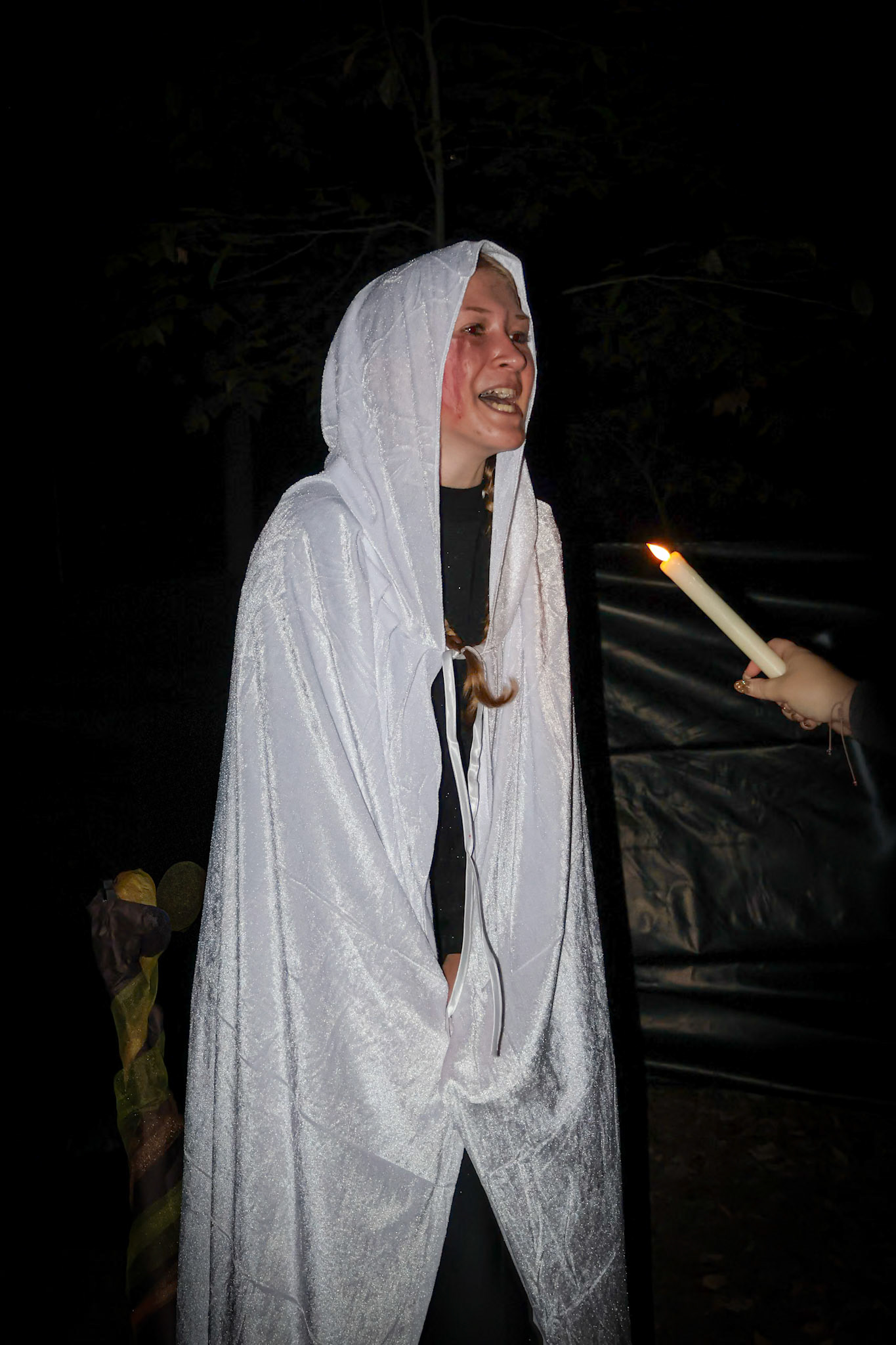 Scared for her life, Riley Moeller-Baird hangs over the fire. (Photo by Madelynn Pittman)