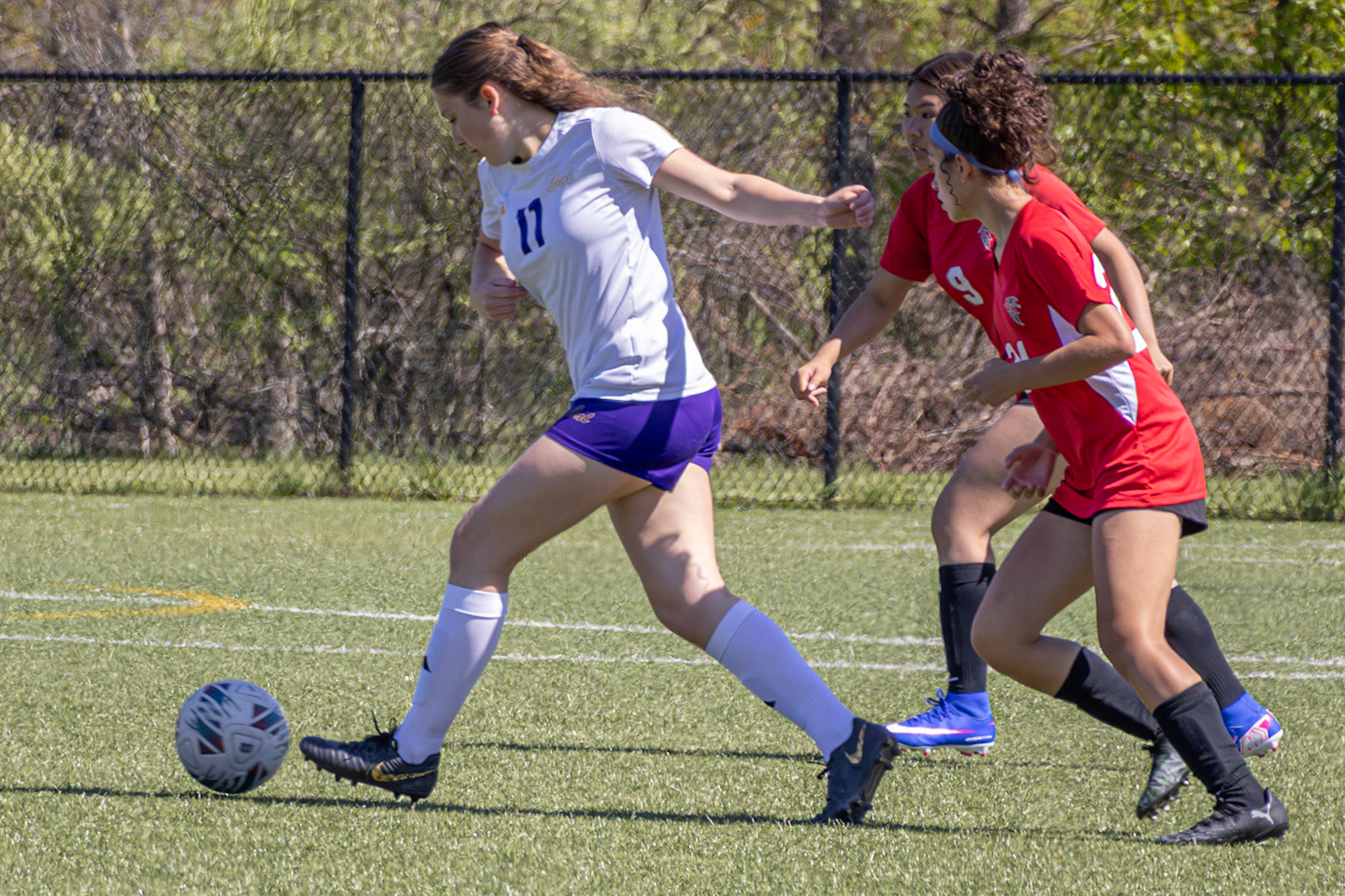 Senior Marie Bozso defends the ball. (Photo by Eva Sierra)
