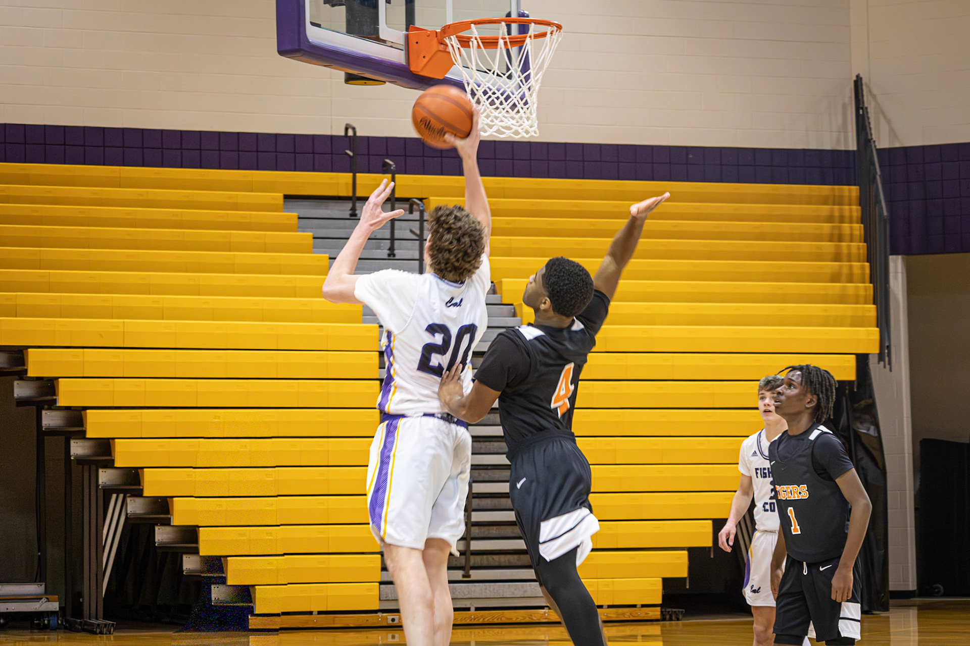 Freshman Caleb Roskiewicz goes for a hard layup while on a fast break. (Photo by Thomas McKee)
