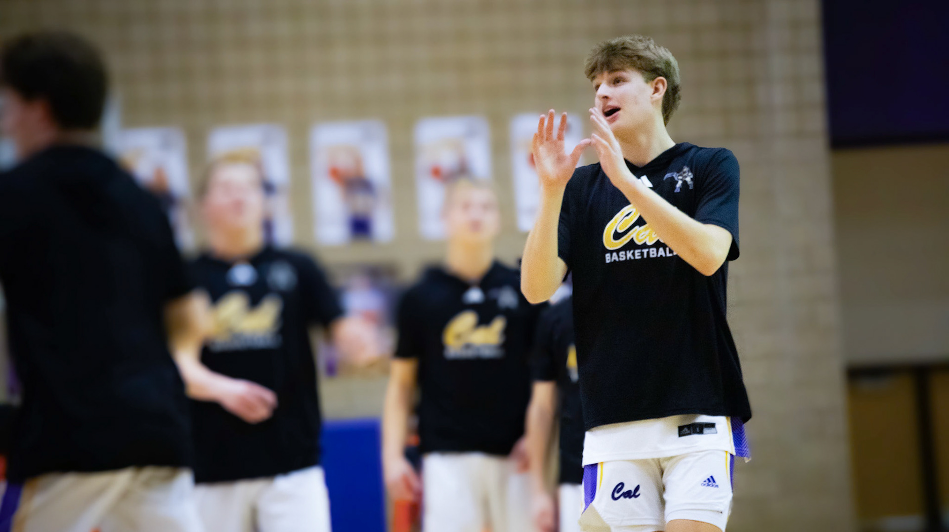HERE Alex calls for the ball to shoot around and get warm for the game, working to knock down shots during the game. (Photo by Lilly Myers)