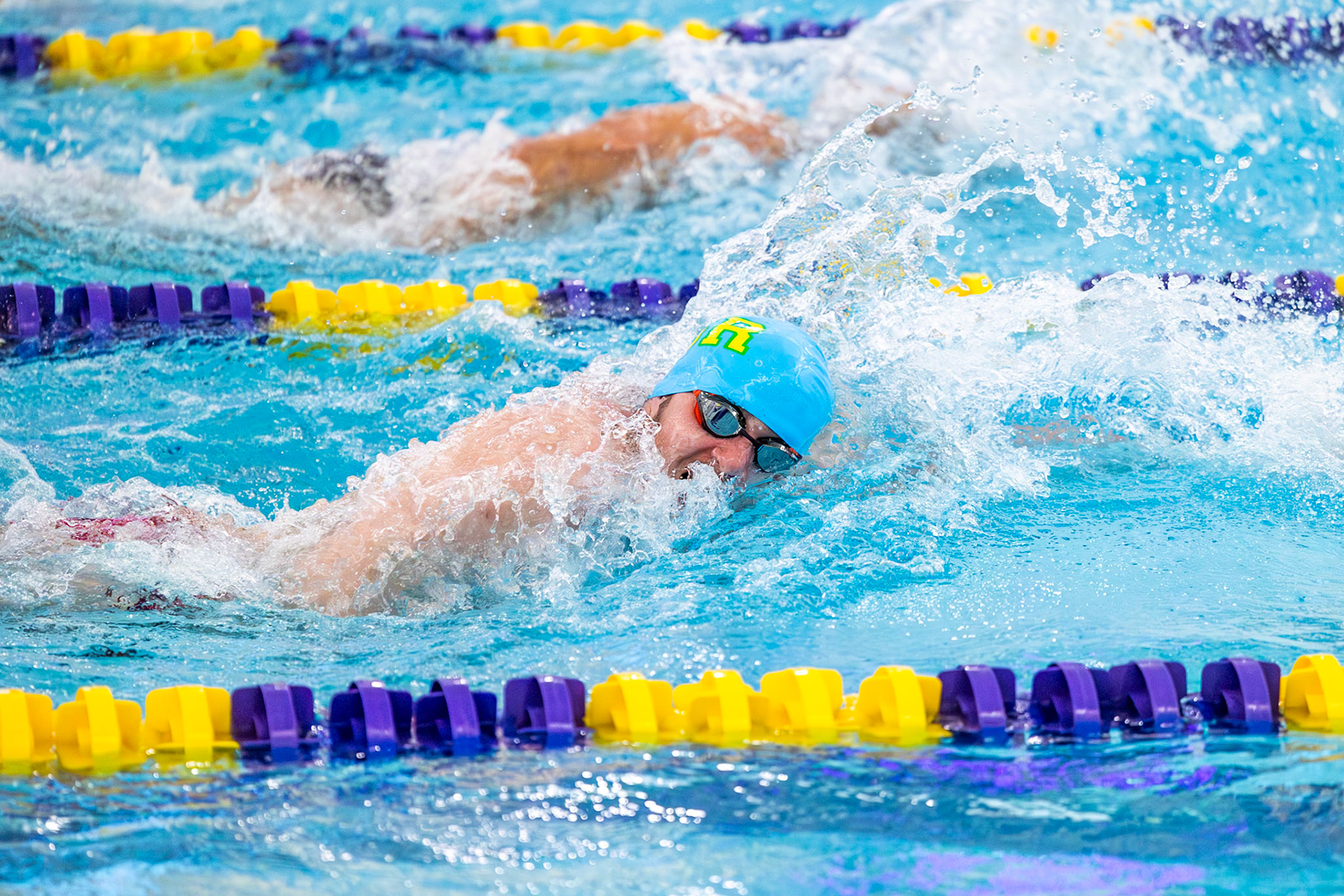 Nolan Fitzgerald competes in the 50-yard freestyle, giving full effort from the start. (Photo by Hailey Thayer)