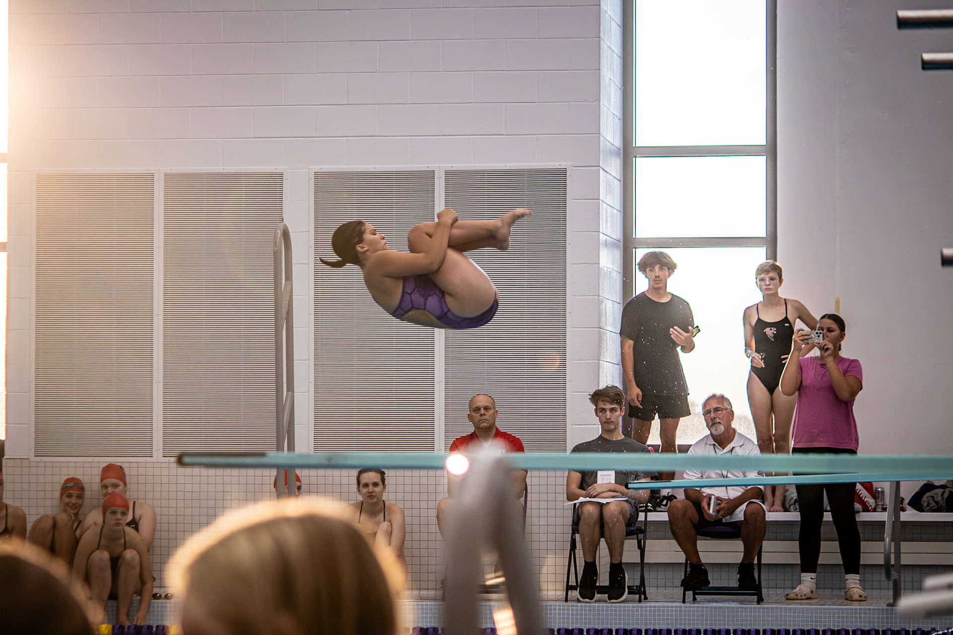 TUCKIN' Felicity Fanco completes her inward flip in tuck, one of her better scoring dives. (Photo by Abigail Tava)
