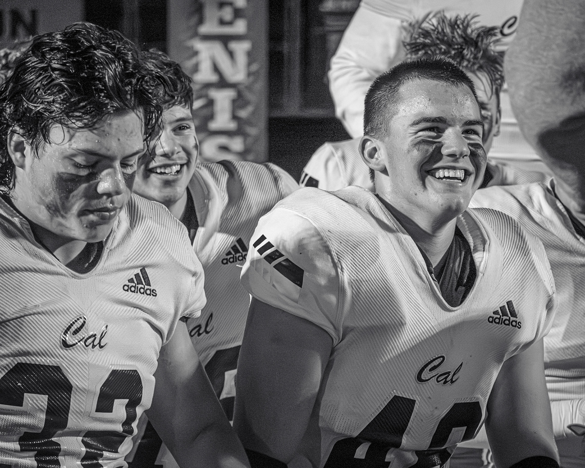 After a big win against the Jenison Wildcats, Elliot DeVries smiles, celebrating a successful season. (Photo by Ella-Grace Wickens)