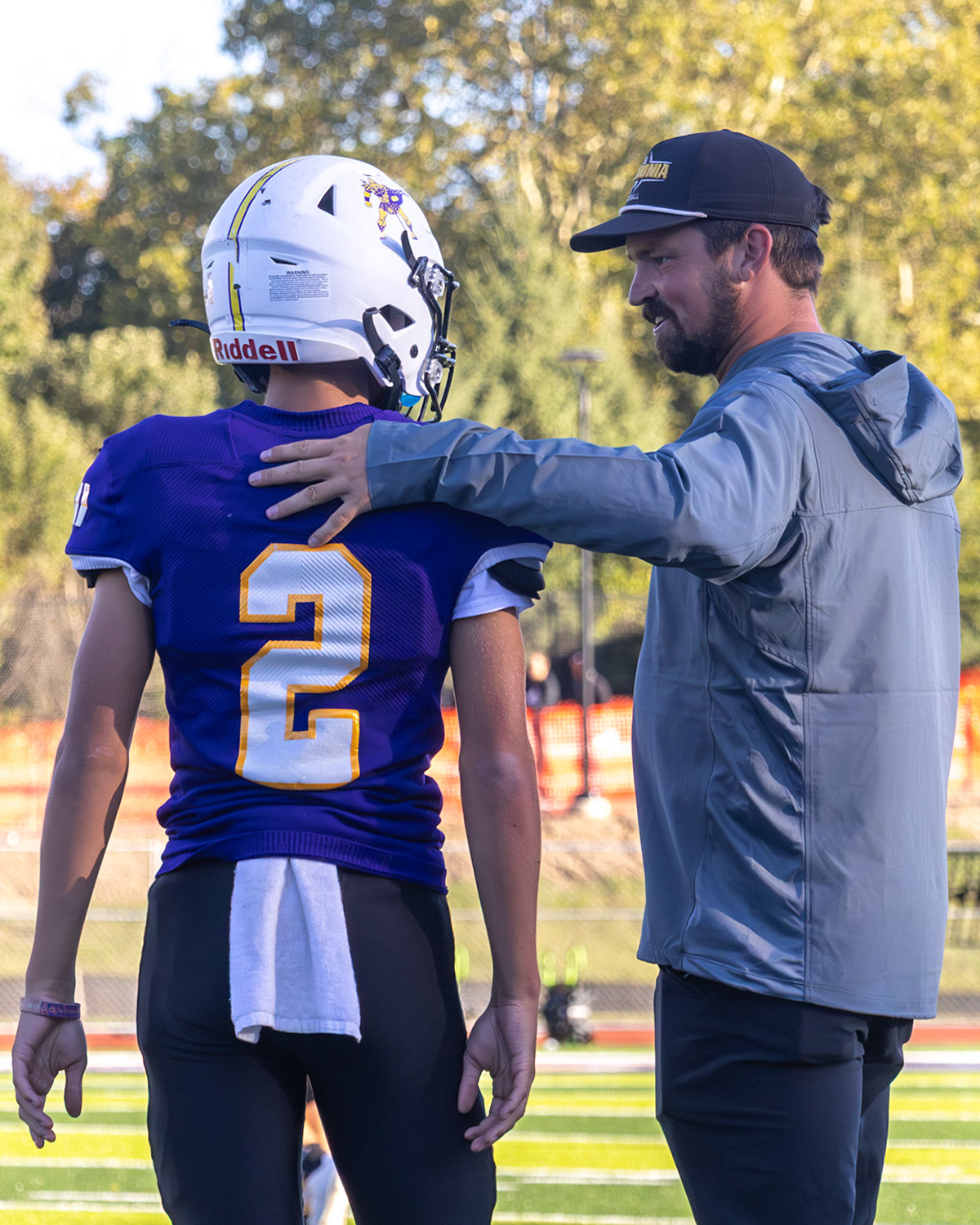 Prior to starting the second half freshman quarterback Bryce Johnson recieves a talk from coach Zoet before heading back out onto the field. (Photo by Ella-Grace Wickens)