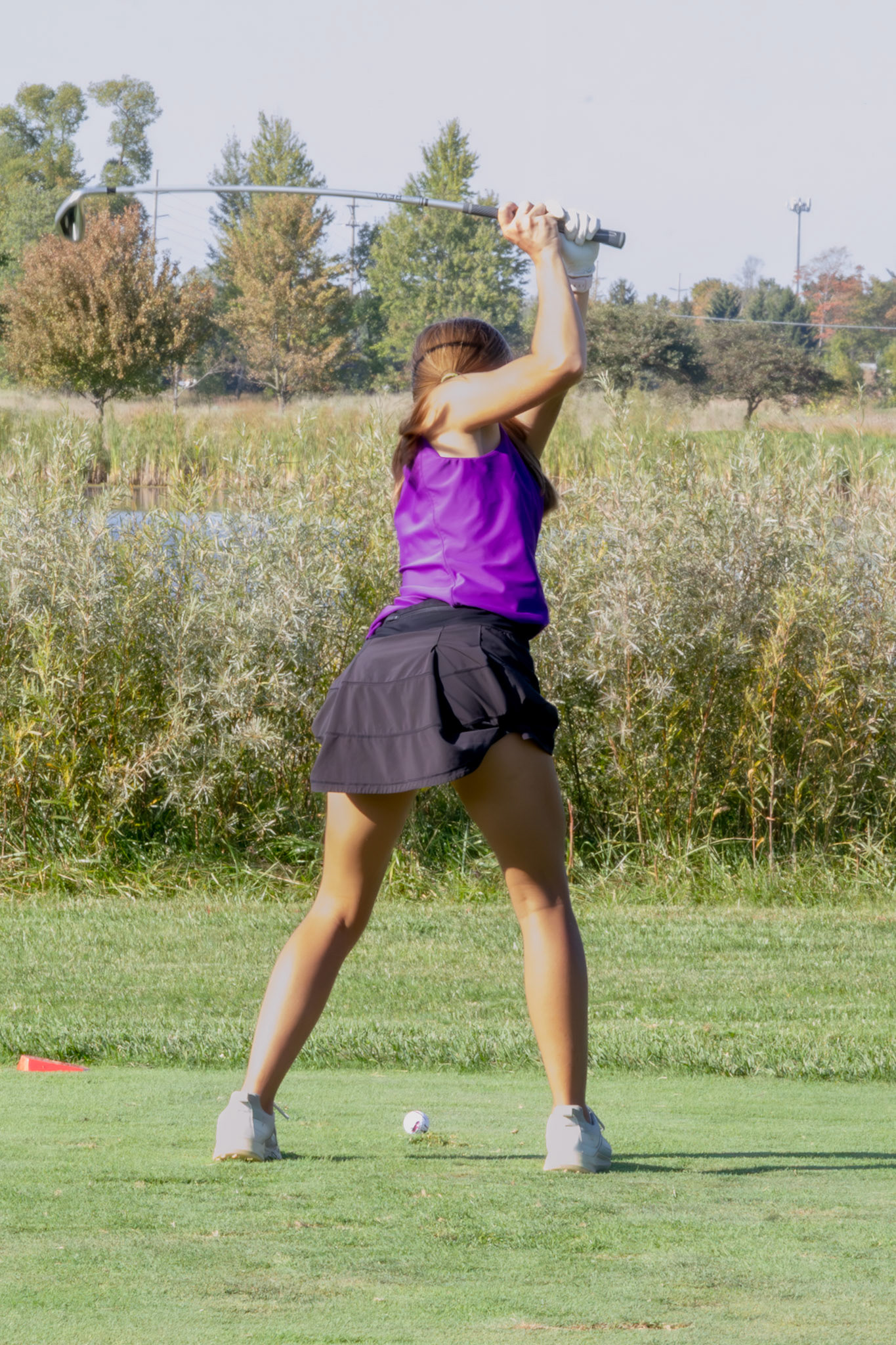 STEADY SWING Junior Lauren Scheid has a nice shot sticking the green. (Photo by Ryder Born)