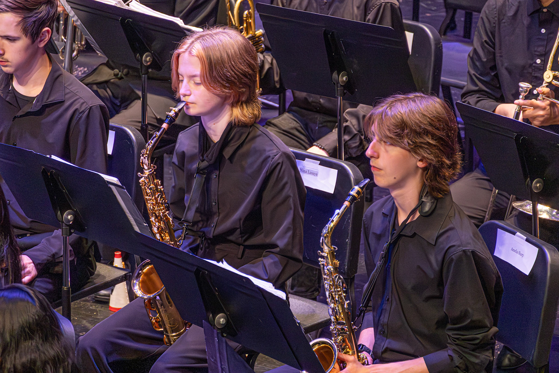 Sophomores Cole McKenna and Kendyl Nonhof take a rest during their song and catch their breath. (Photo by Eva Sierra)