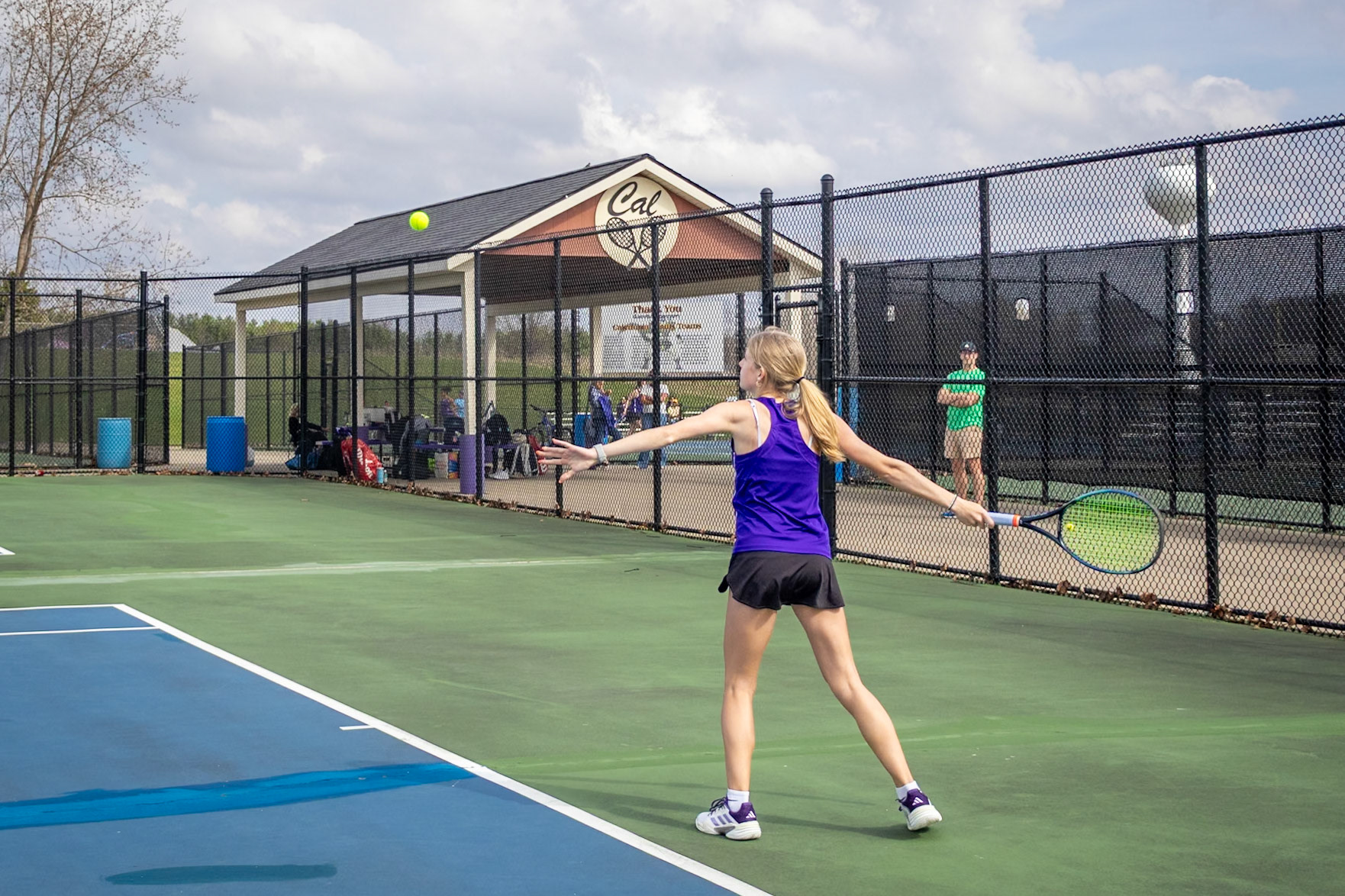 Gretchen VanderEide steps into the moment, swinging with precision as she drives the ball across the court during the match against Mona Shores. (Photo by Hailey Thayer)