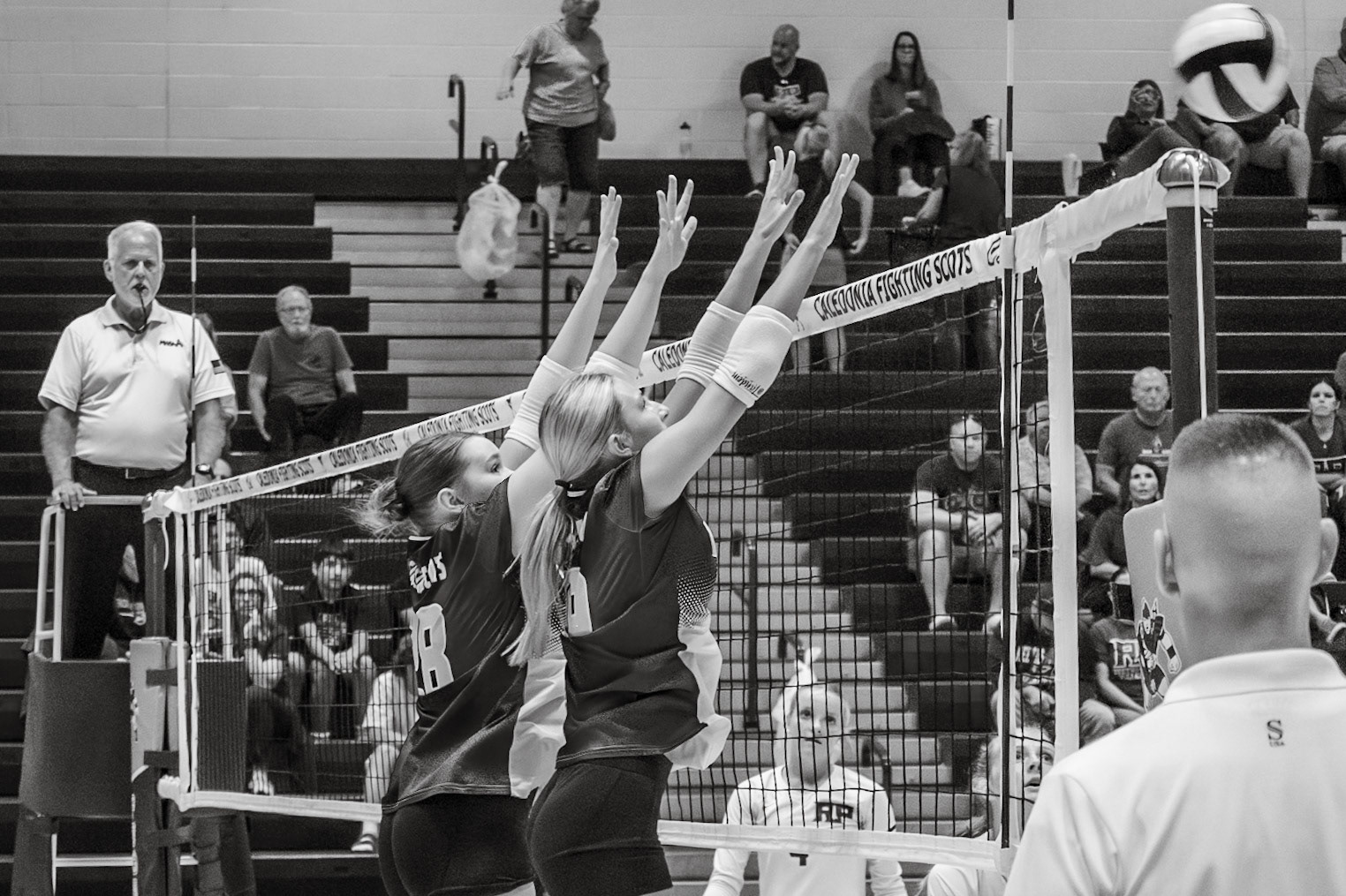 Ruby Larson and Emma Bowman rise to block a powerful spike. (Photo by Aslyn Crocker)