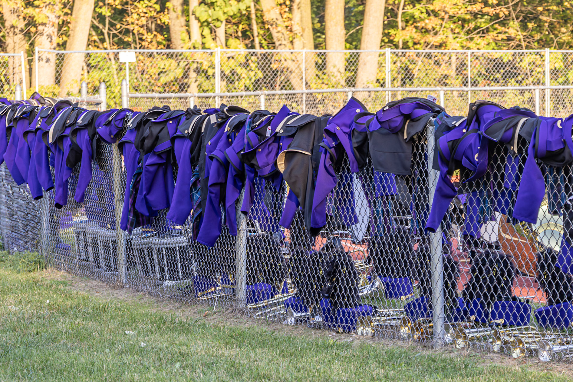 Marching band uniforms hang ready for the next performance. (Photo by Kayley Martin)
