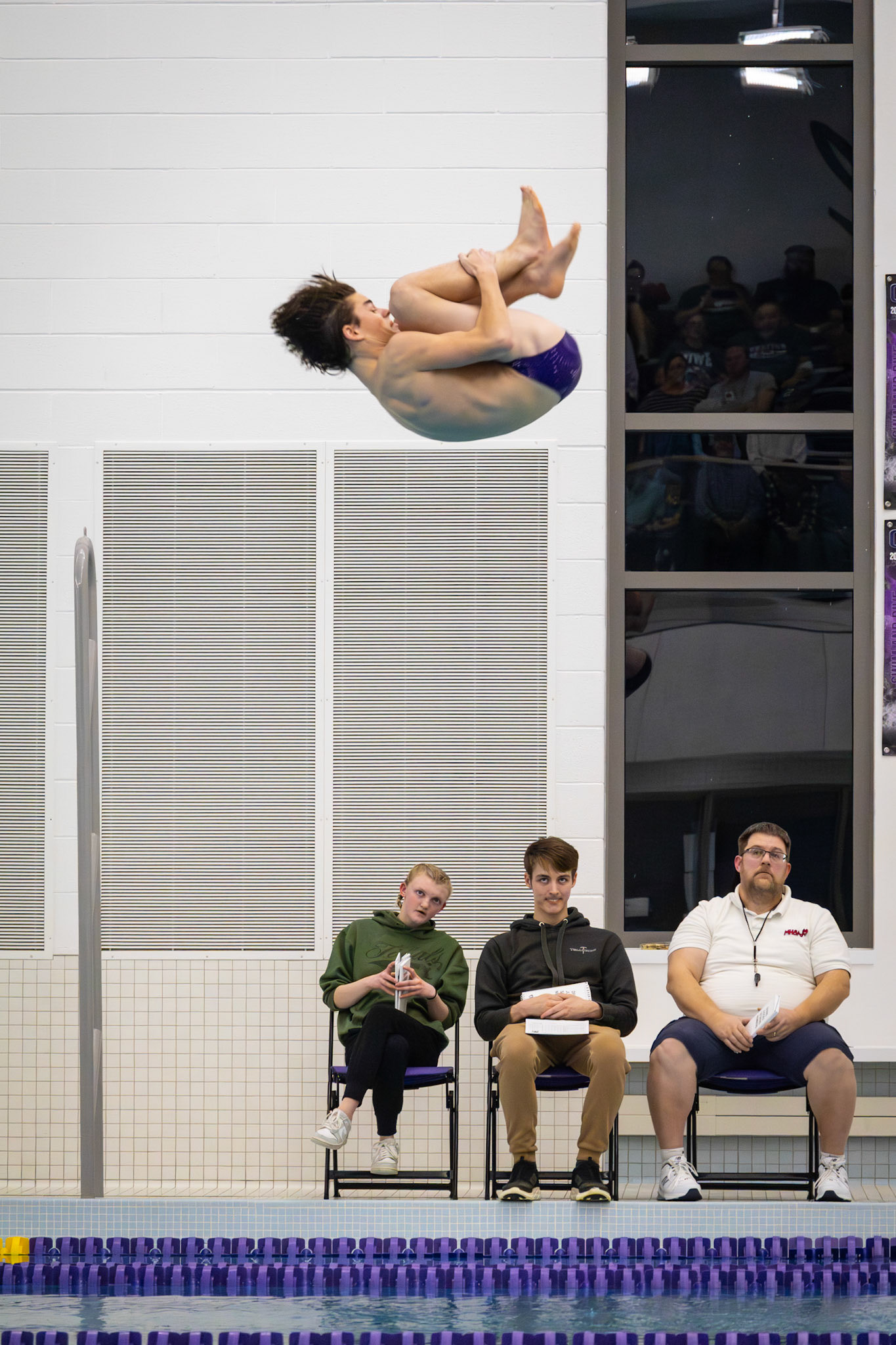 Seth Miller completes a controlled flip off the board, impressing with both form and execution. (Photo by Hailey Thayer)