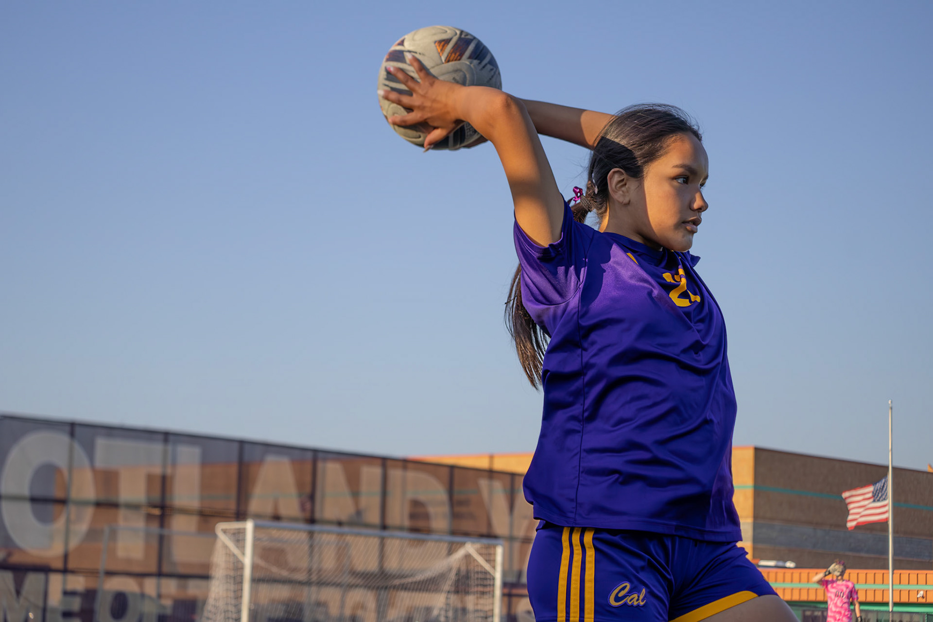 Jazmyn Thompson sends the ball overhead for a throw-in. (Photo by Ava LaBine)