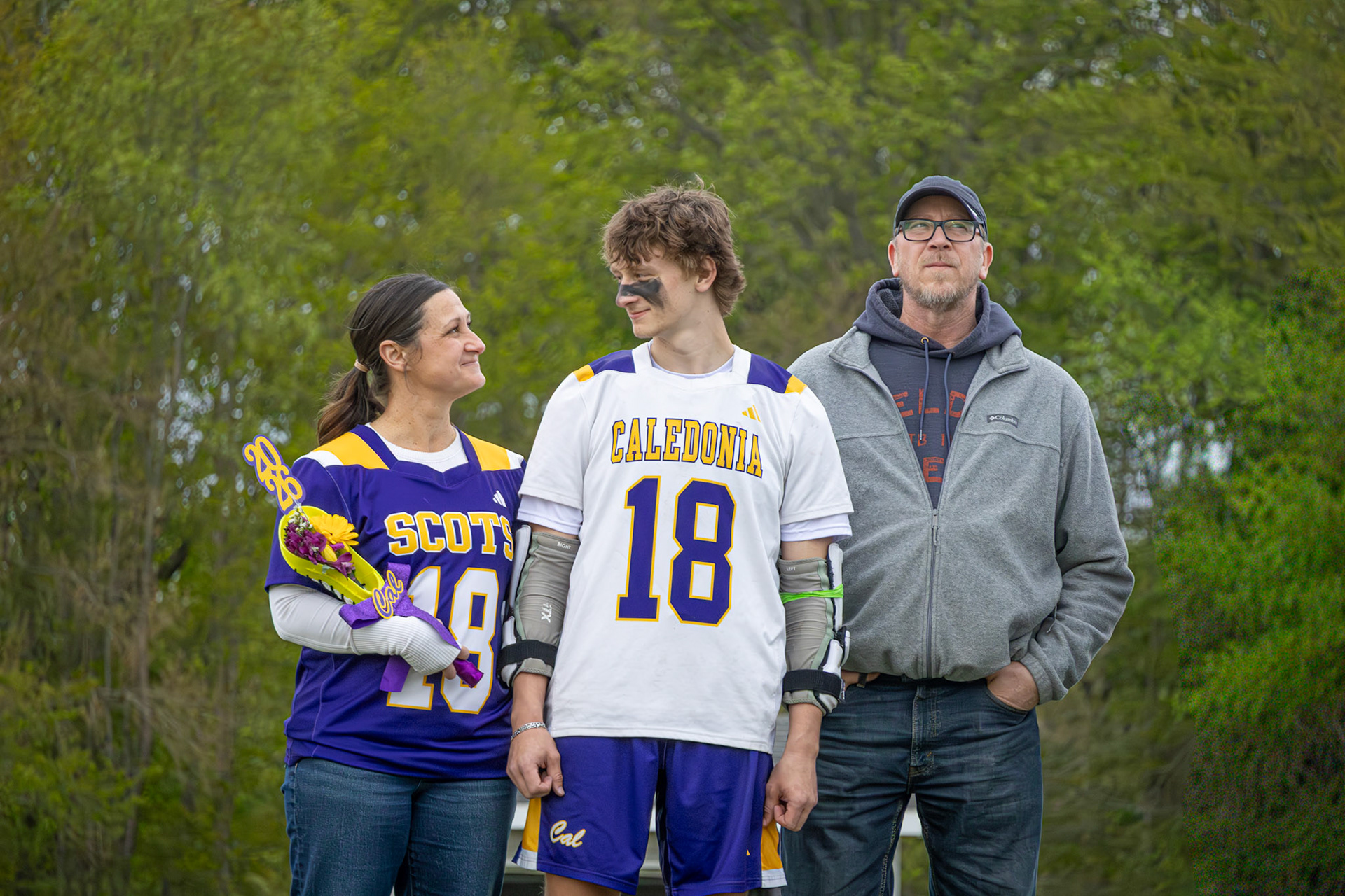 (10) Austin Osborn shares a smile with his mom on senior night to live in the moment within the recap of his high school lacrosse career. (Photo by Emma Garza)
