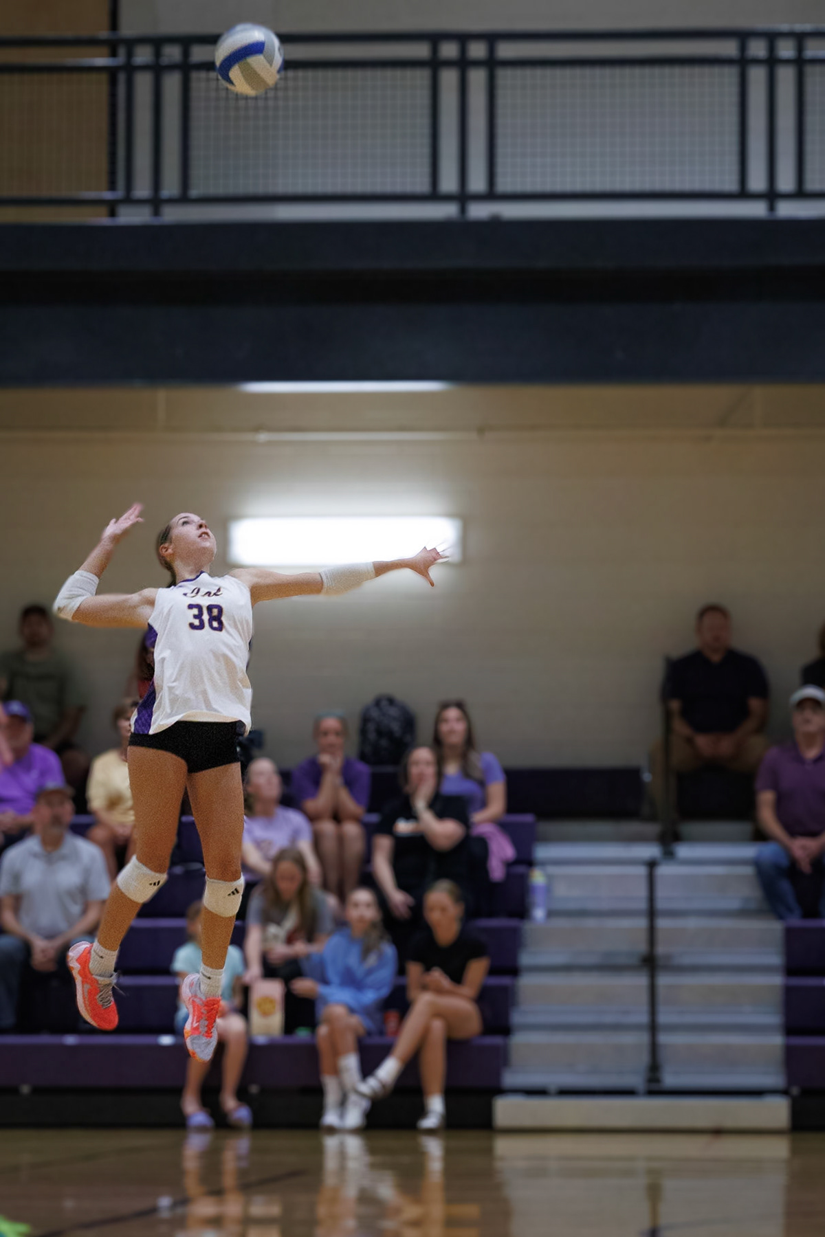 Allison Dudicz rises at the net, fully extended to attack the ball.(Photo by Joseph Bawi)
