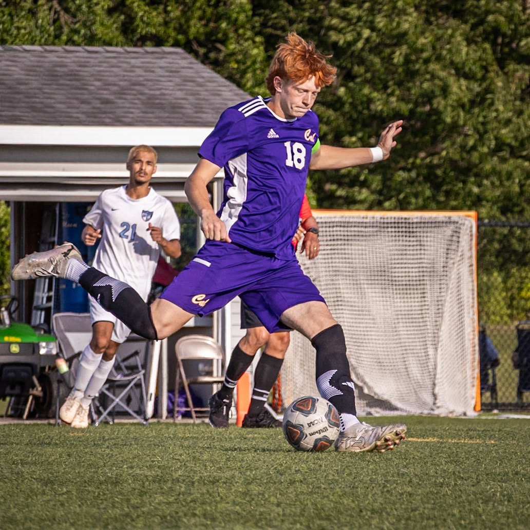 KICKIN' IT With eyes on the ball, Team Captain Brecken Byrd winds up for the kick. (Photo by Akaela Daman)
