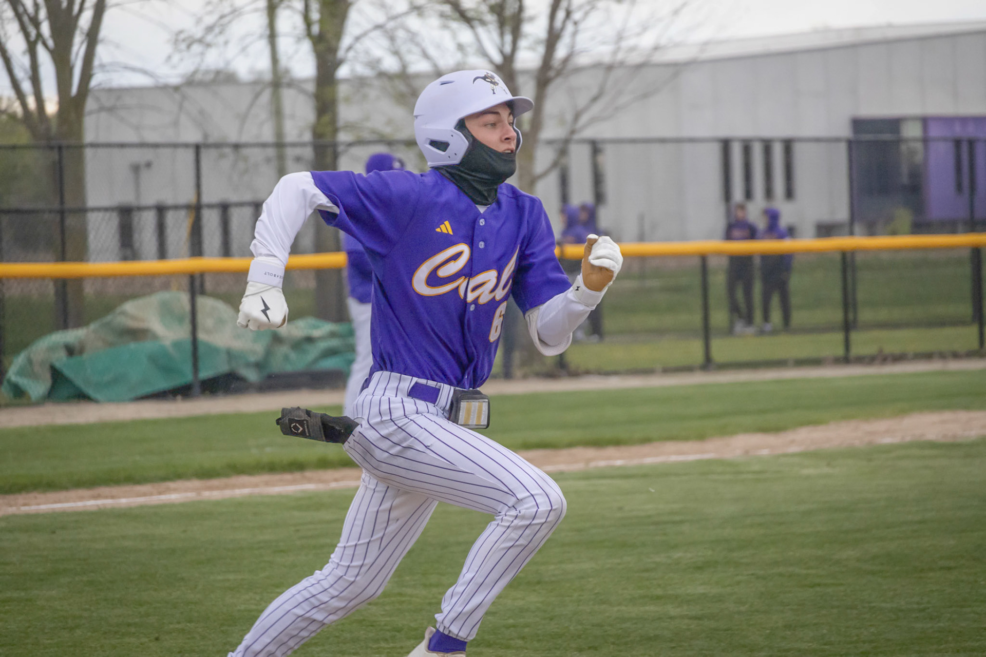 After a solid hit, Drew Nichols sprints toward first hoping to beat the throw to the bag. (Photo by Ella-Grace Wickens)