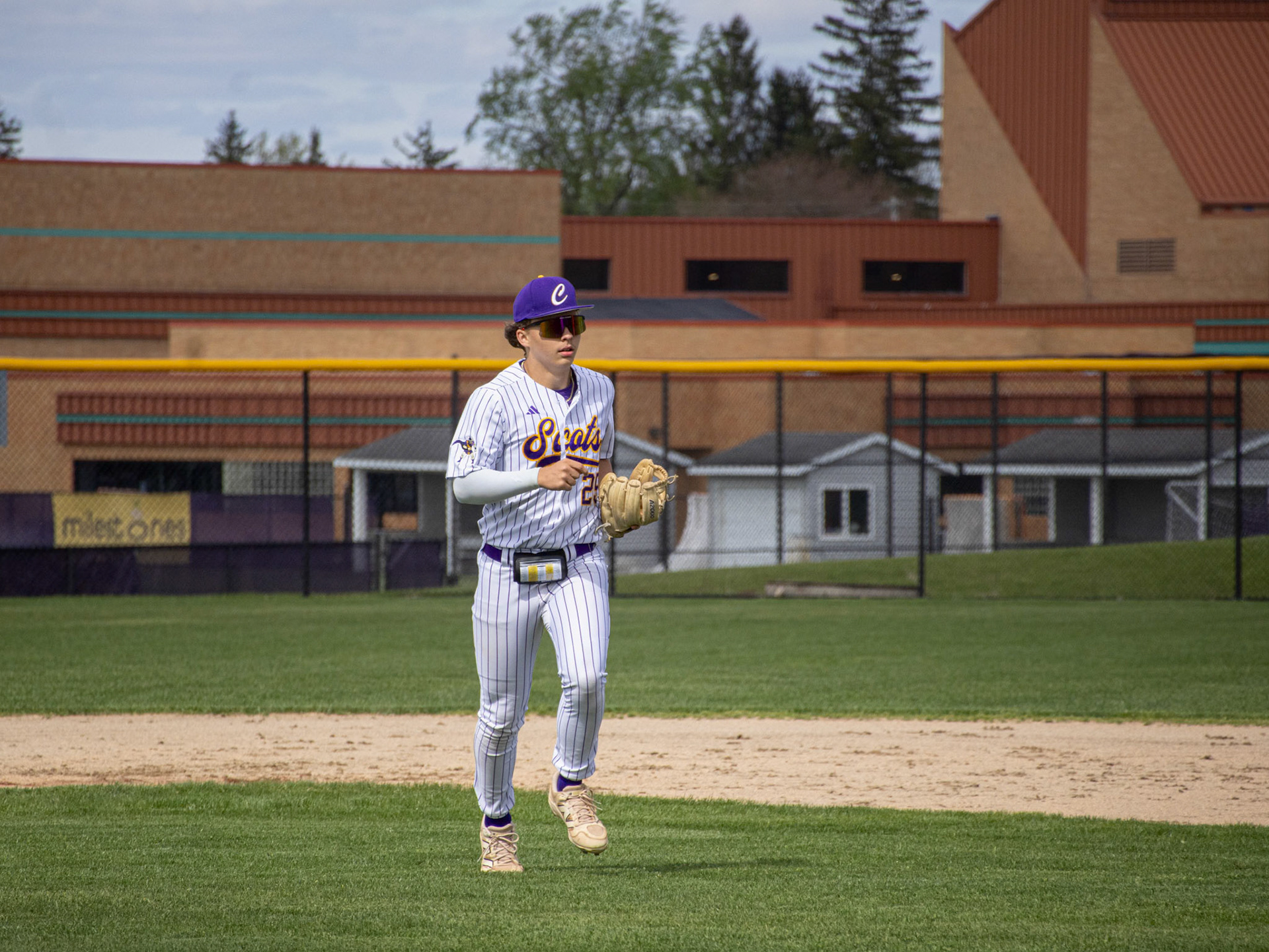 Hustling back to the dugout, Eli Jurmu gets ready for his first at bat. (Photo by Ella-Grace Wickens)