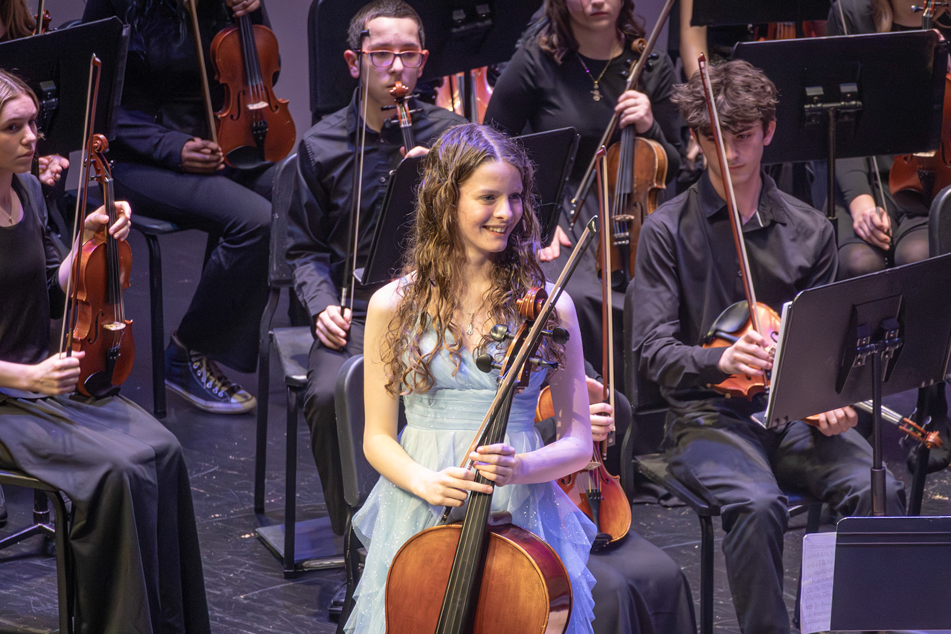 STUNNING SOLO: Hannah Bennett smiles as audience cheers for her after her solo. (Photo by Abigail Douglass)