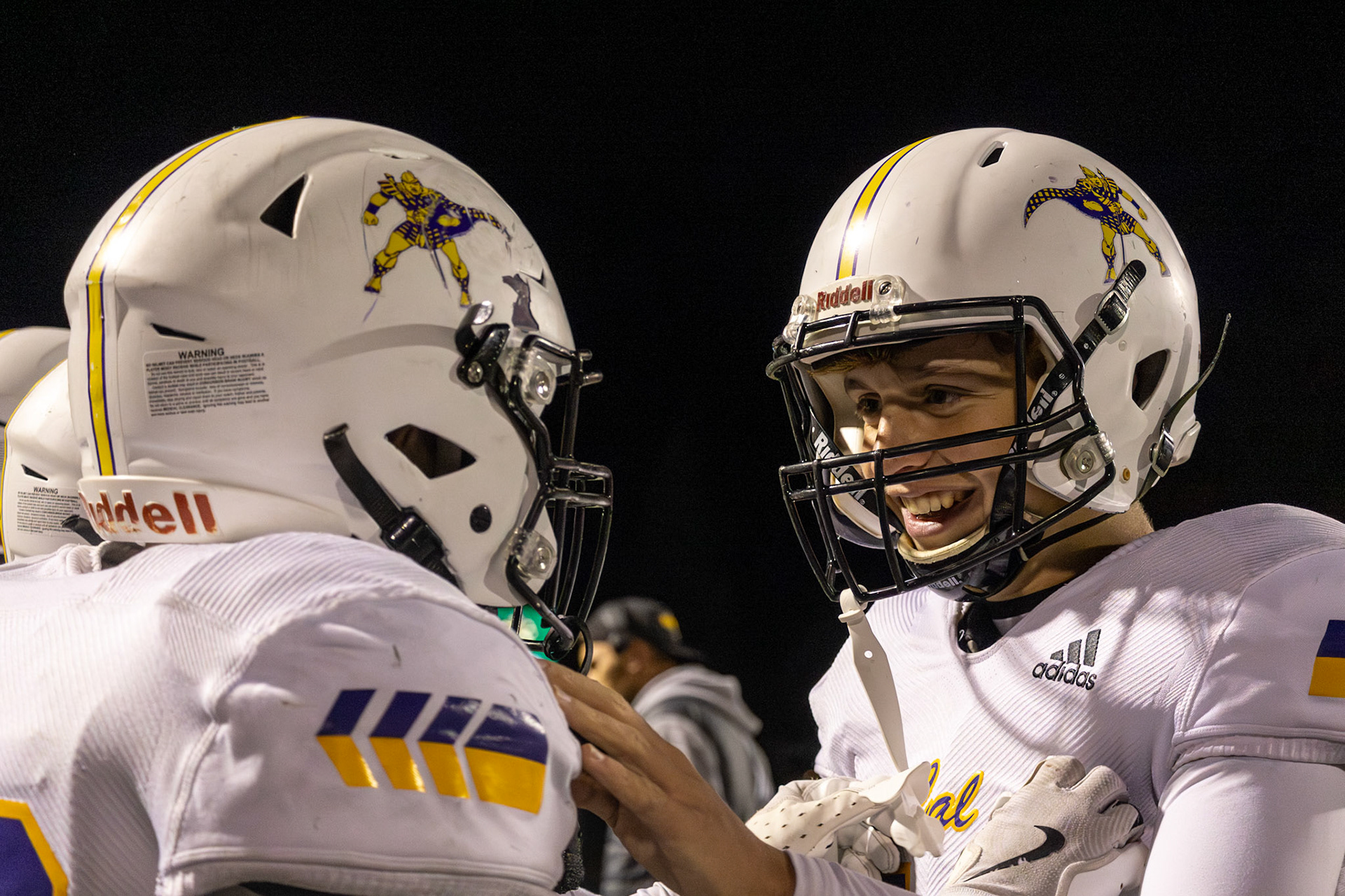 Exchange student Leonard Dufresnes celebrates his first—and final—season of football with teammate Egan Otto before returning to France next year. (Photo by Ella-Grace Wickens)