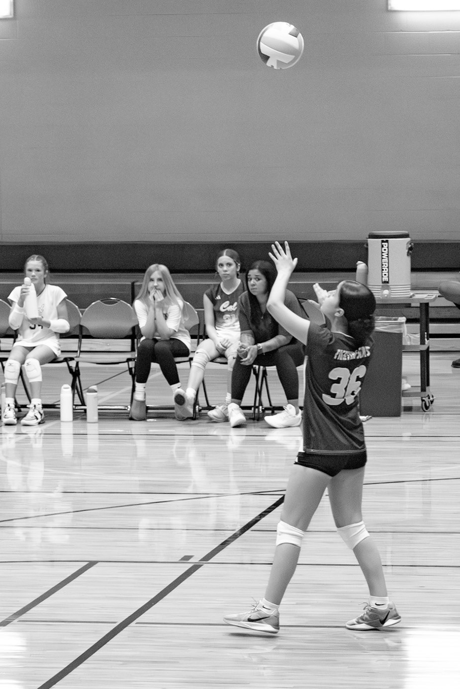 Freshman Jocelynn Sanchez fires up for the serve. (Photo by Elsha Bytwork)