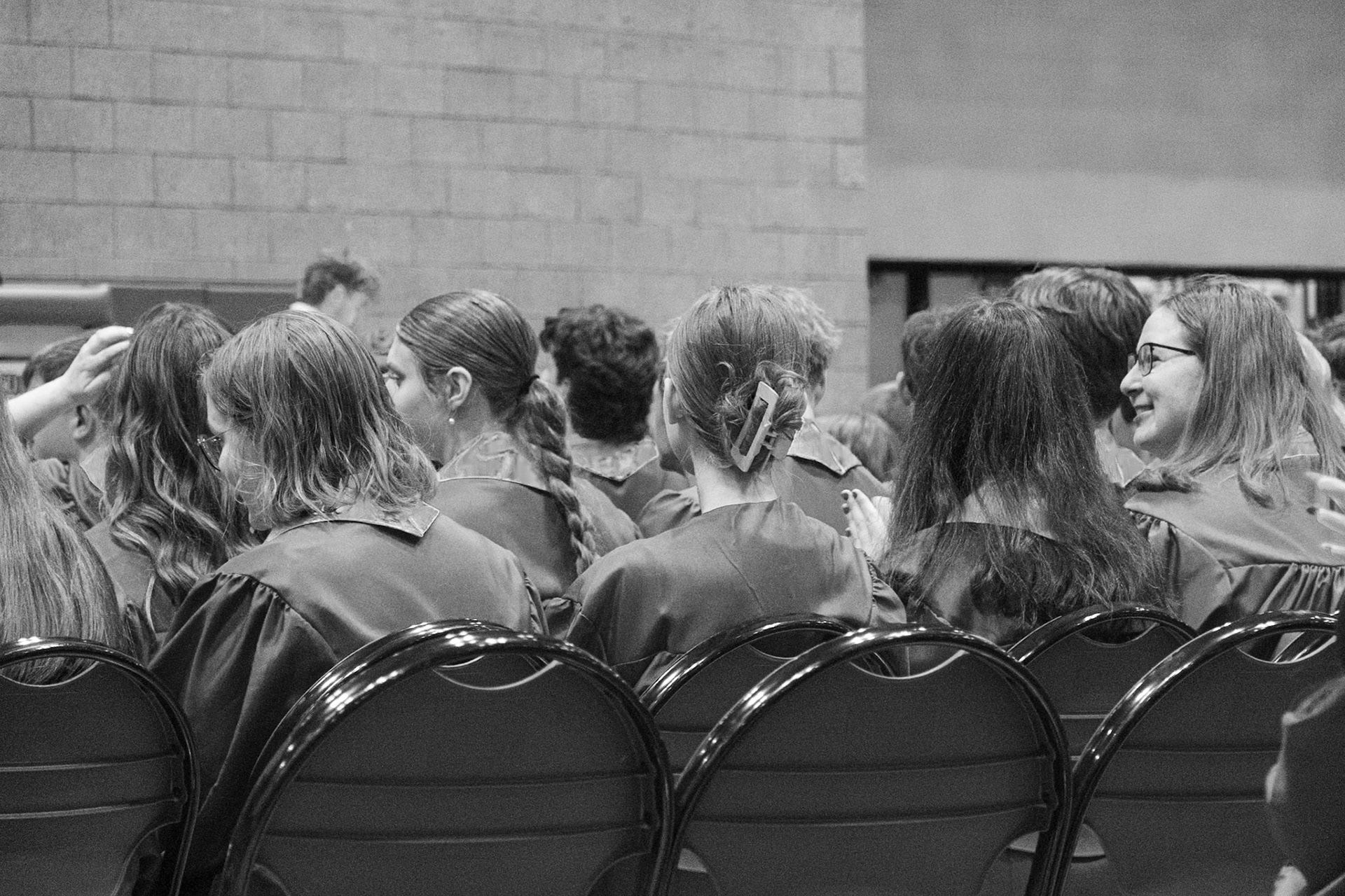 Seniors talk amongst each other before DJ Robinson delivers his speech. (Photo by Emma Garza)