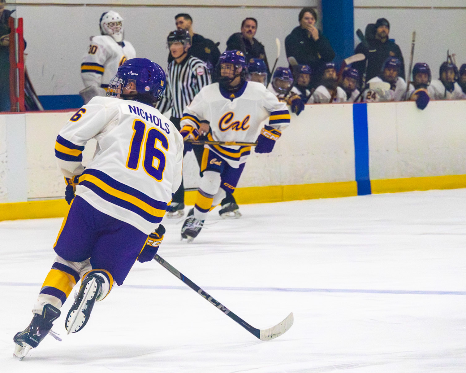 Drew Nichols picks up the pace as the puck glides toward him. (Photo by Avarey Lippert)